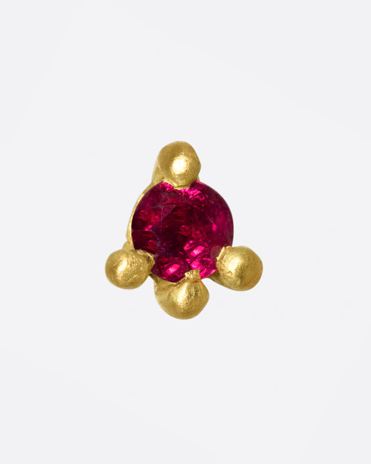 This earring is really about the ruby; large and saturated, it's a statement in itself.