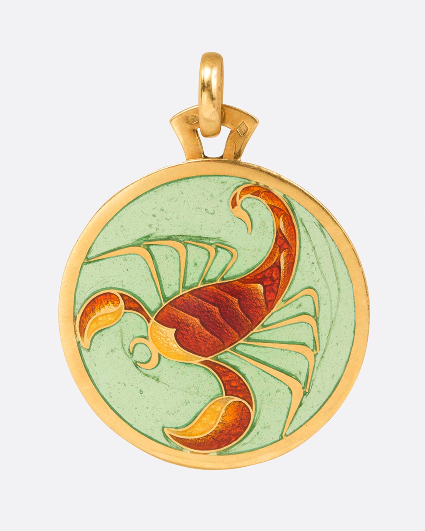 Round gold and enamel plique-a-jour pendant with a scorpion, shown from the front.