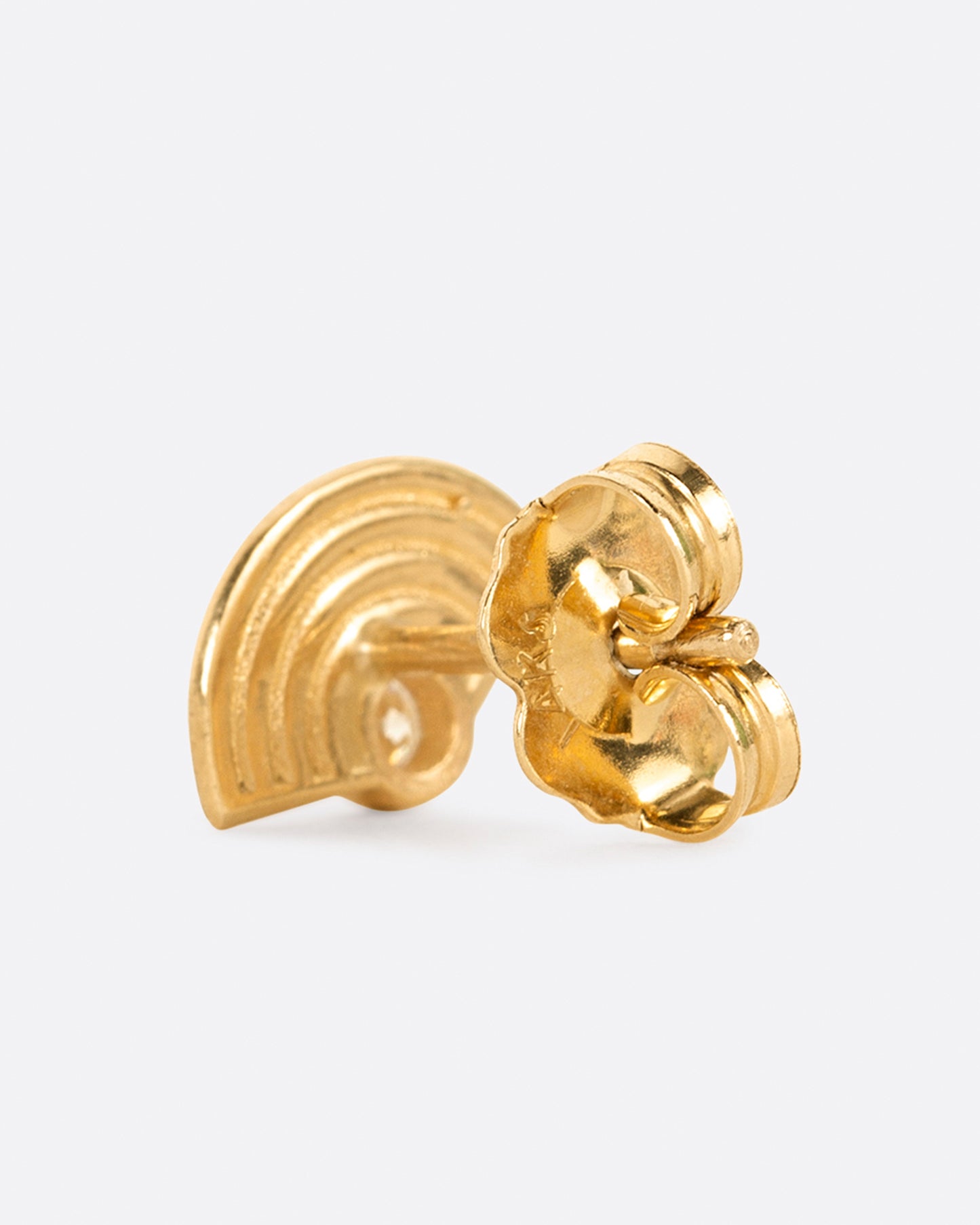 A yellow gold stud earring in a rainbow shape with a diamond at the bottom center. Shown from the back.