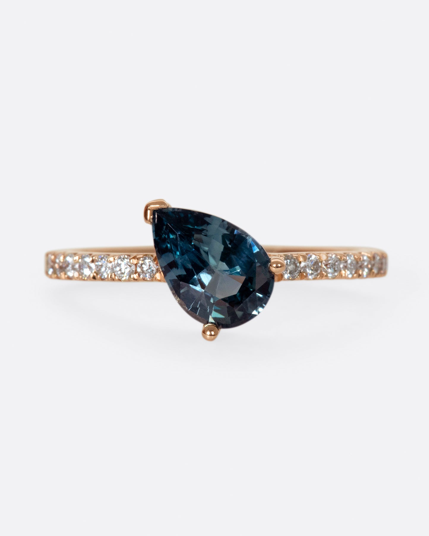 The saturated blue-green sapphire is the star of this ring.