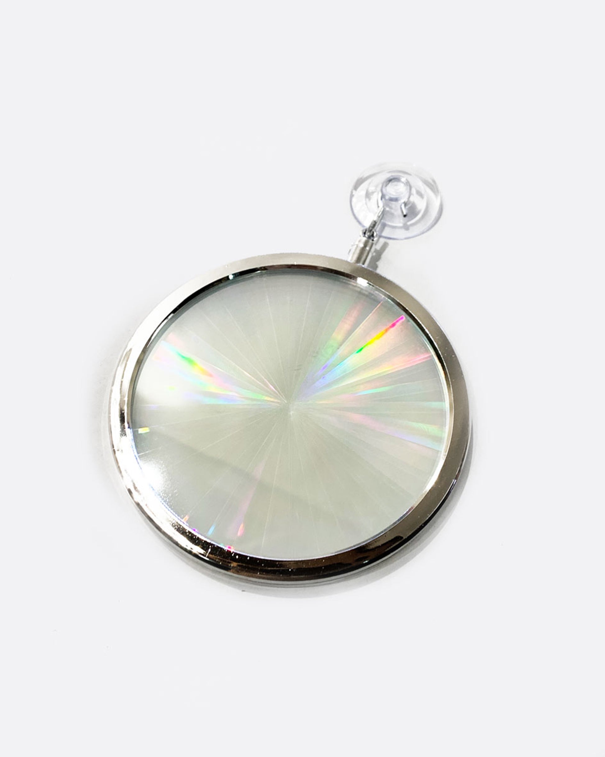 A circular rainbow maker with a silver edge and suction cup at the top. Shown from the front.