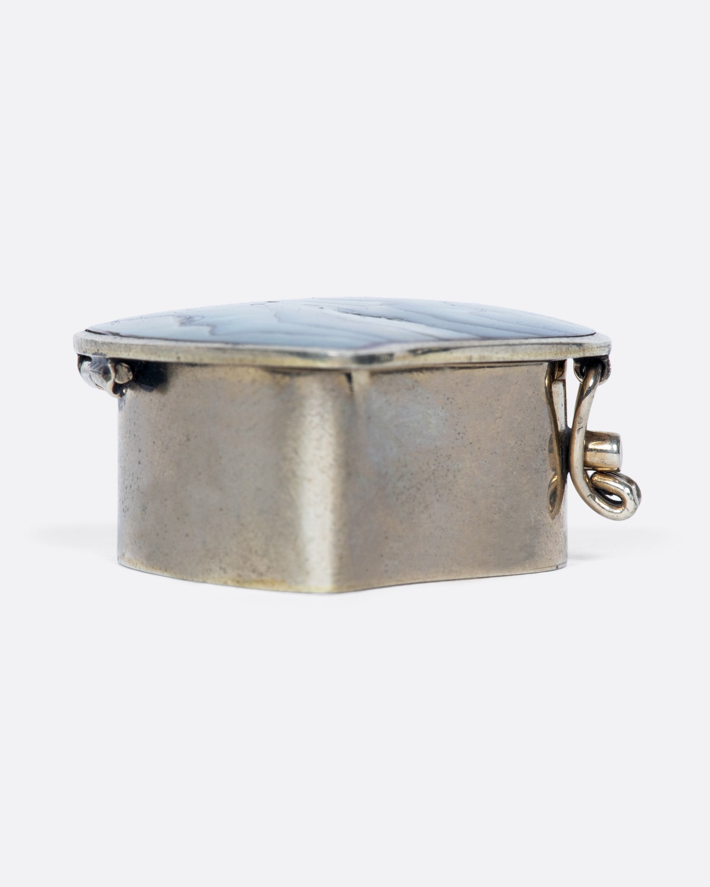 The heart-shaped abalone shell inlaid in this beautiful vintage box always makes us smile and think of the beach.