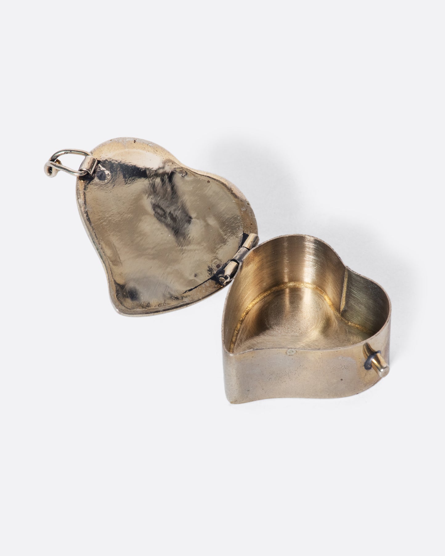 The heart-shaped abalone shell inlaid in this beautiful vintage box always makes us smile and think of the beach.