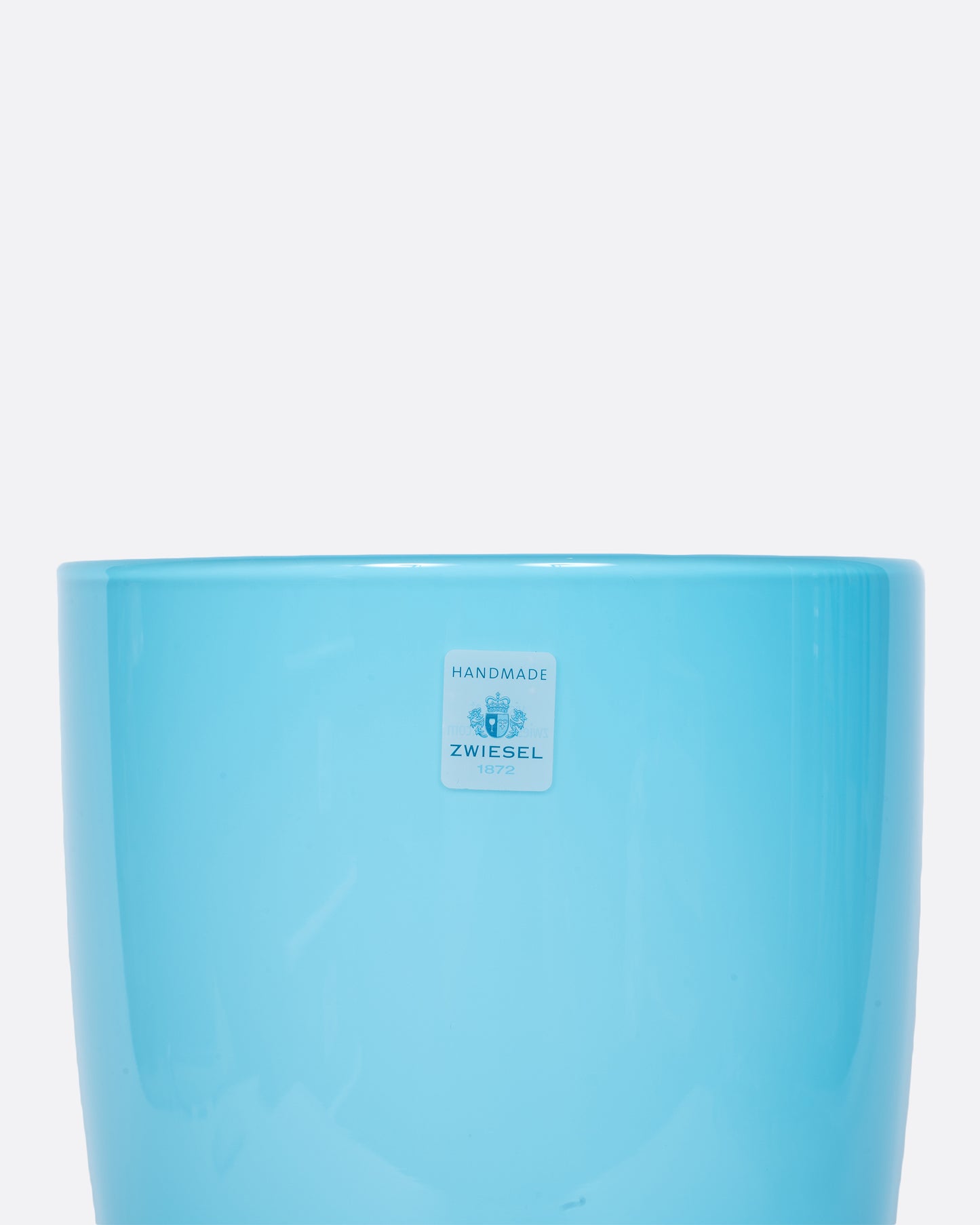 This sky blue vase has a layer of white glass on its interior to making the blue even brighter.