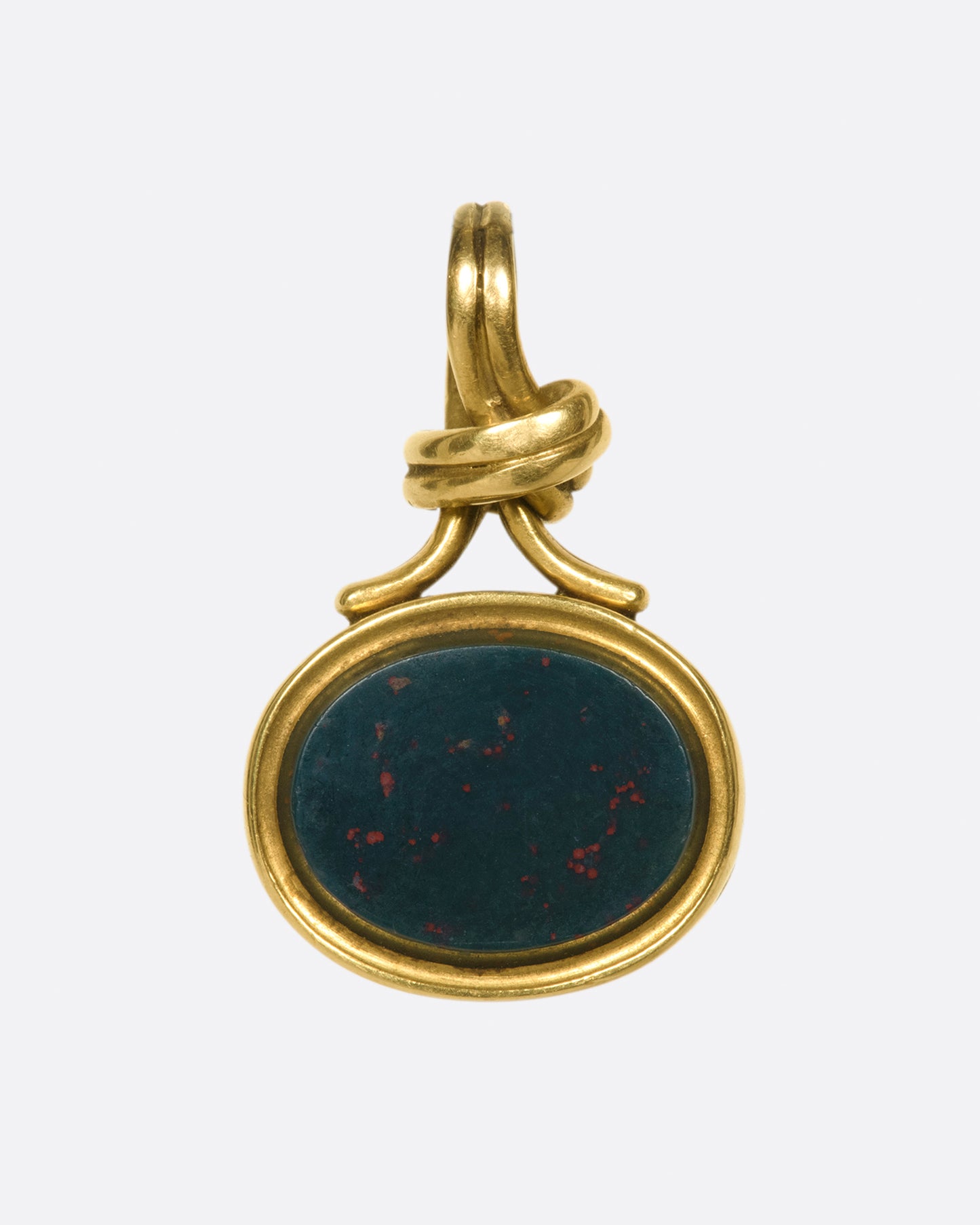 A knotted, solitaire pendant that opens up to reveal two picture framesI