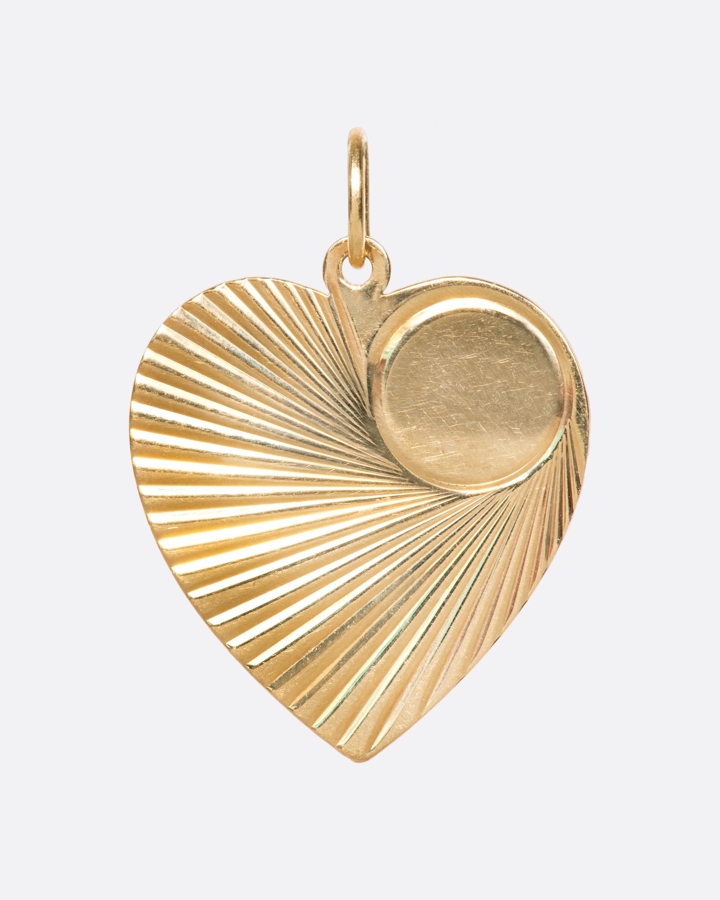 A shiny tag pendant with the perfect focal spot, ready for engraving.