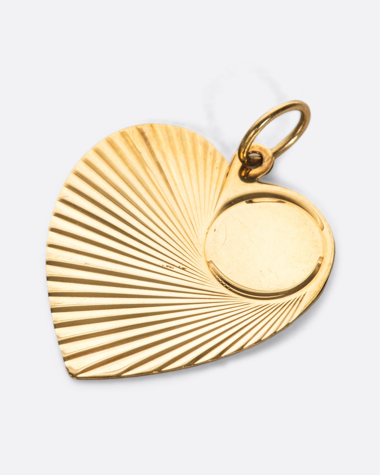 A shiny tag pendant with the perfect focal spot, ready for engraving.