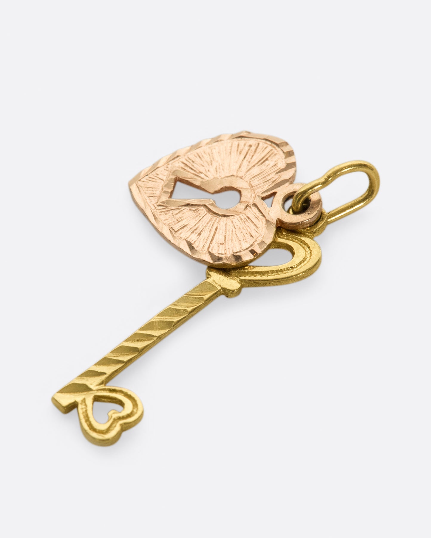 A two-tone, two-part charm with a singular message: Love.
