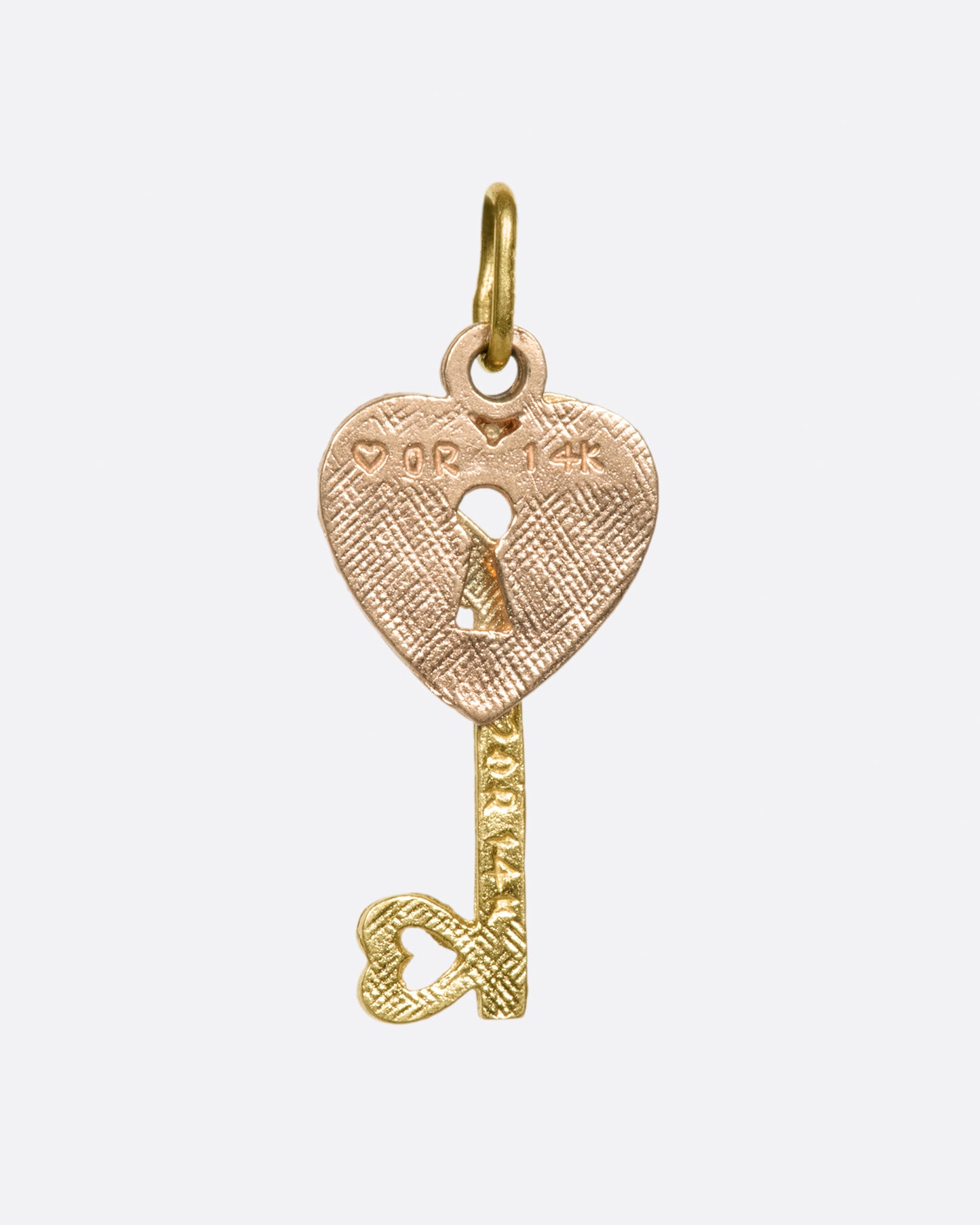 A two-tone, two-part charm with a singular message: Love.