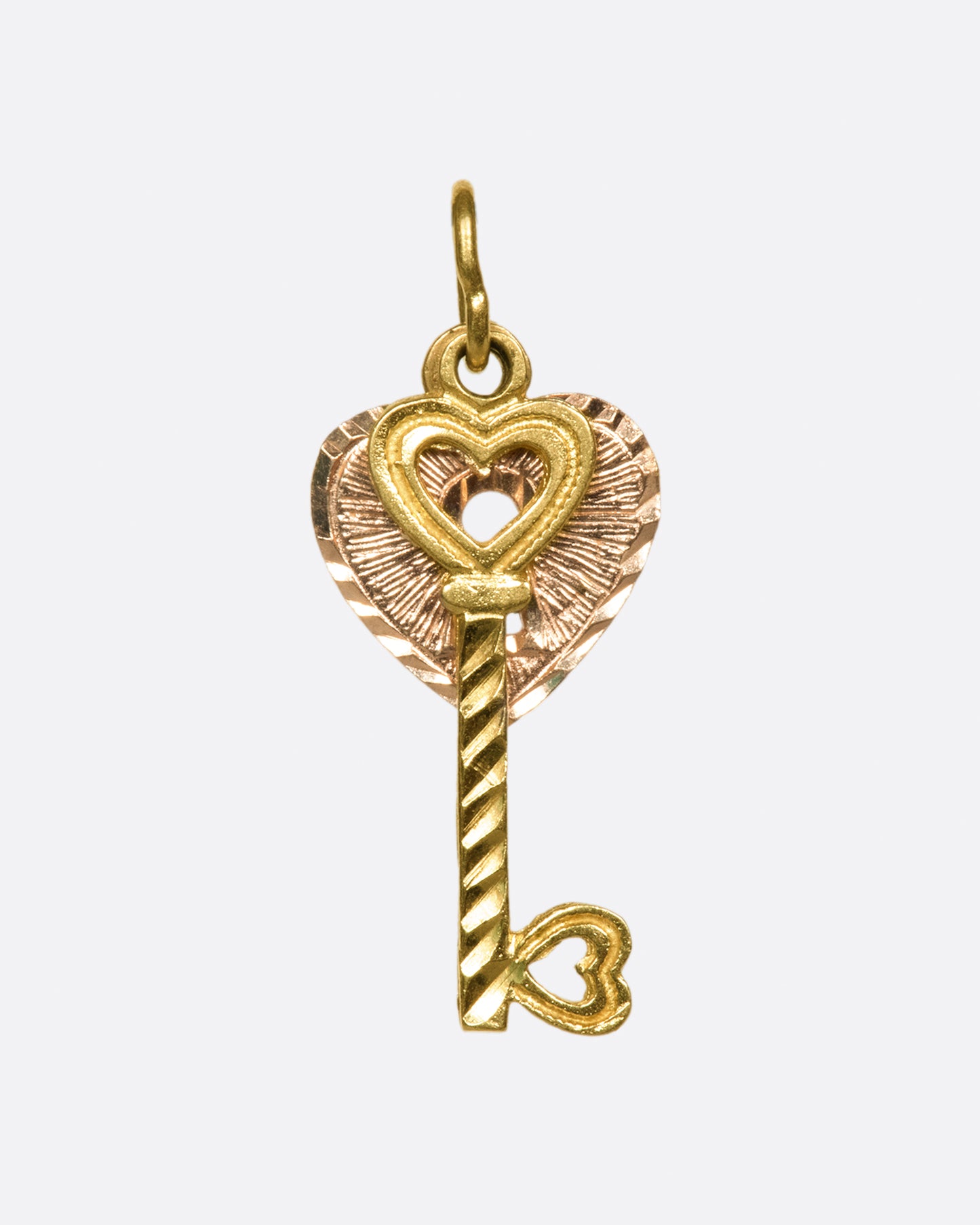 A two-tone, two-part charm with a singular message: Love.