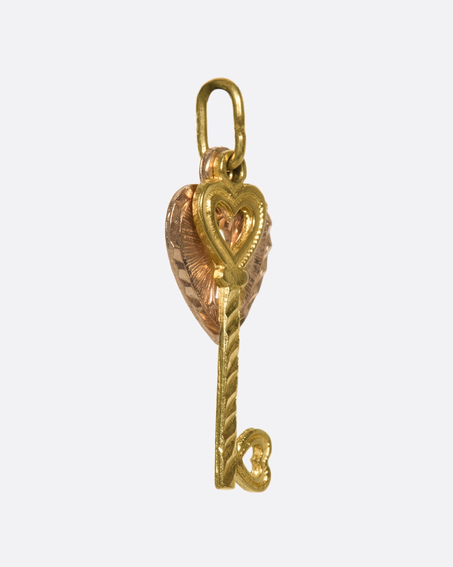A two-tone, two-part charm with a singular message: Love.