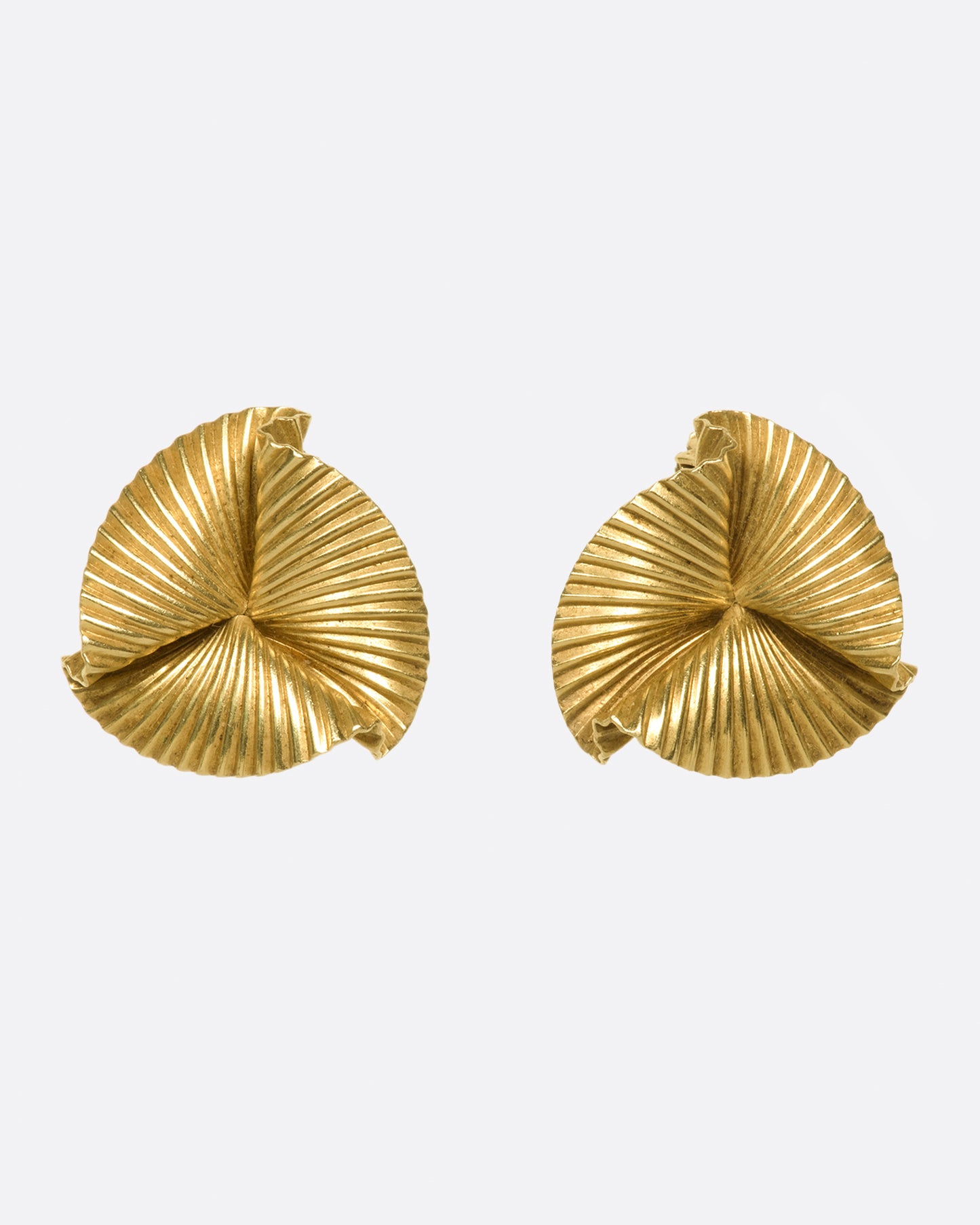 Vintage clip-on 14k gold round fan earrings. These are especially beautiful as the ribbed lines grab light, fanning it across your lobes.