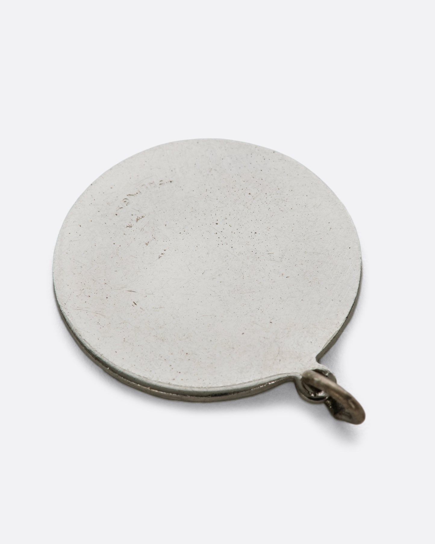 At a distance the heart speaks for this pendant, but the message is spelled out up close.