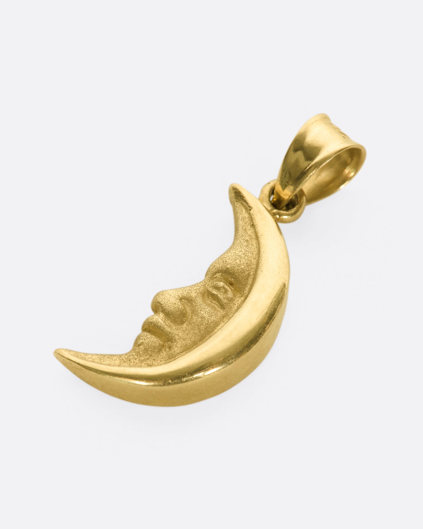 A celestial charm with a wide, tapered bail.