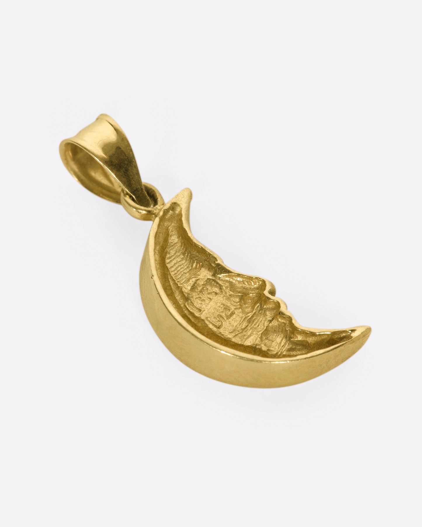 A celestial charm with a wide, tapered bail.