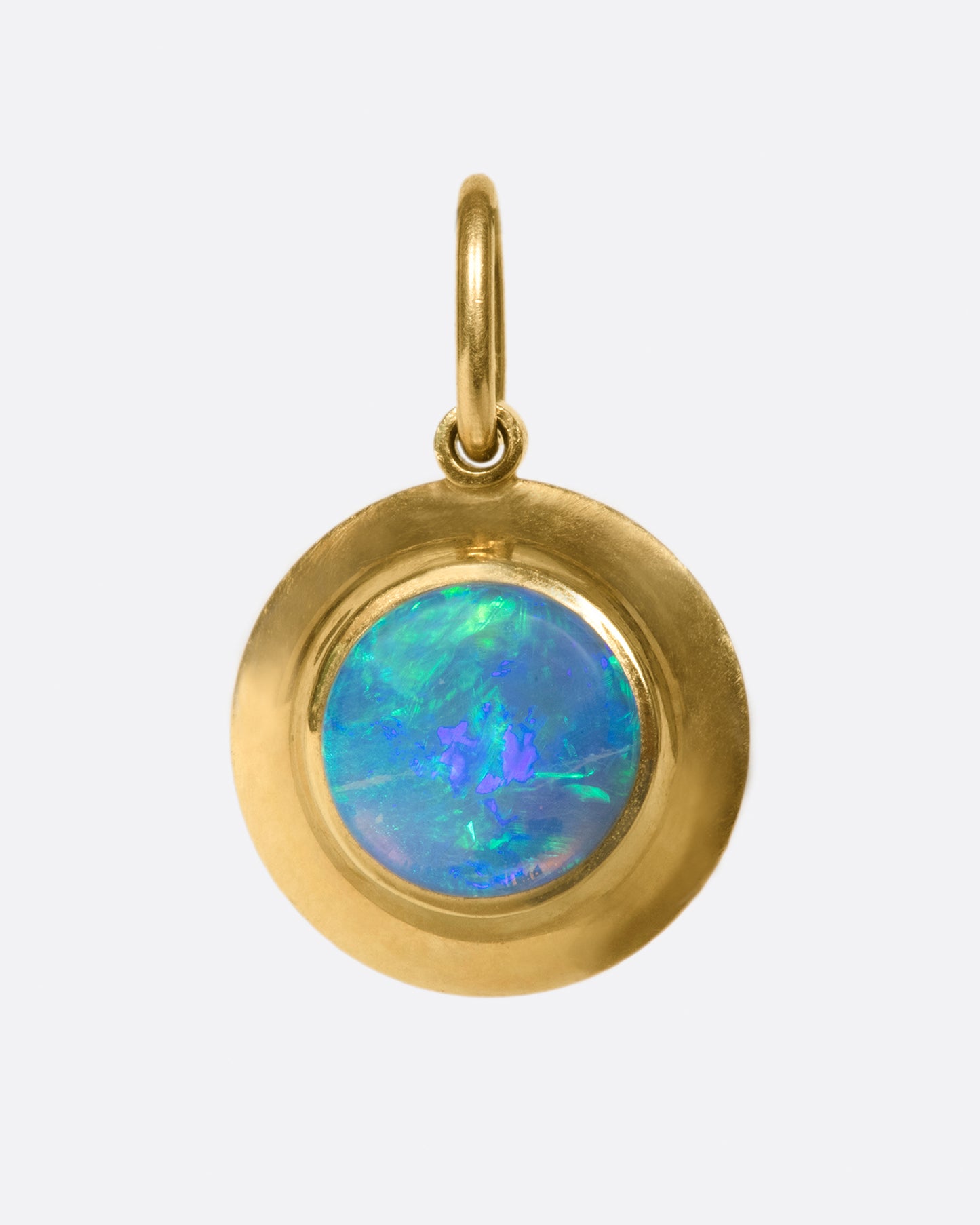 A hefty solitaire pendant with a flashy, bezel set opal.
