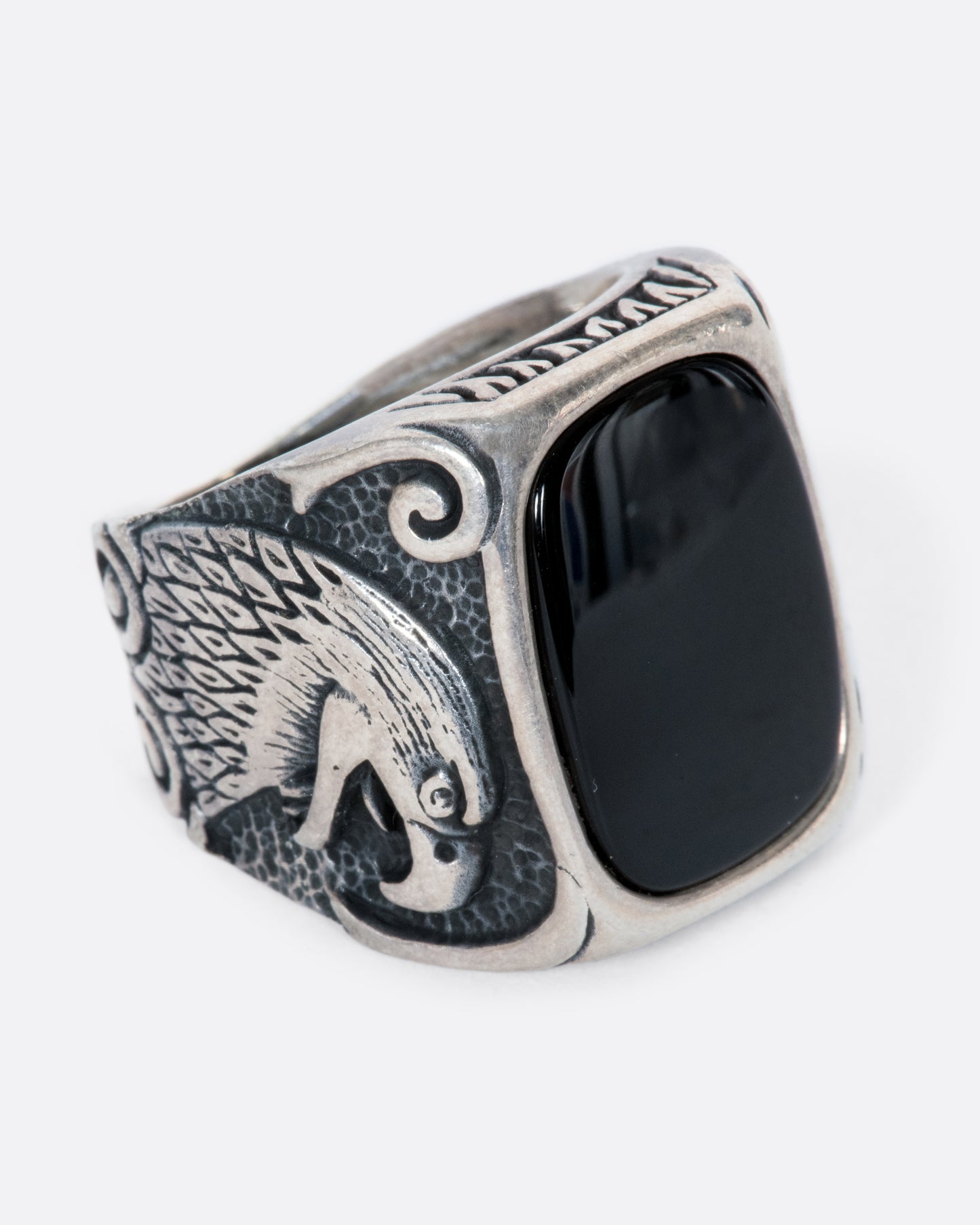 A fierce onyx signet ring with two eagles guarding perched on its shoulders. 