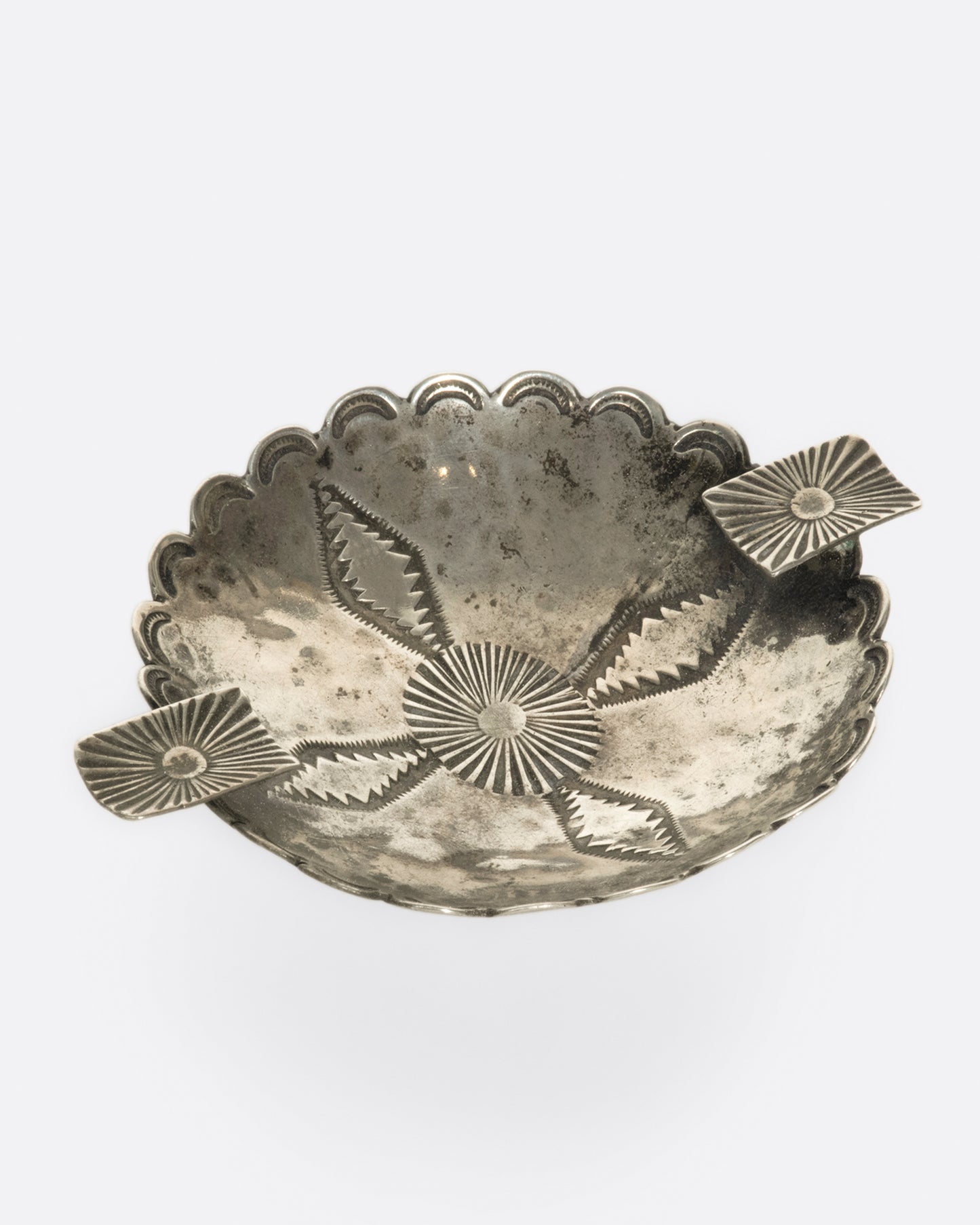The great patina and stamped details on this vintage Native American ashtray are what bring it to life.