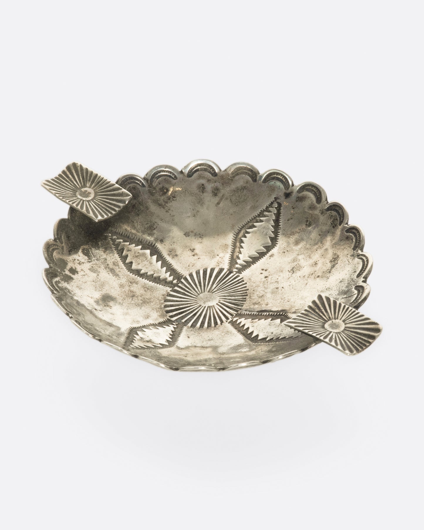 The great patina and stamped details on this vintage Native American ashtray are what bring it to life.