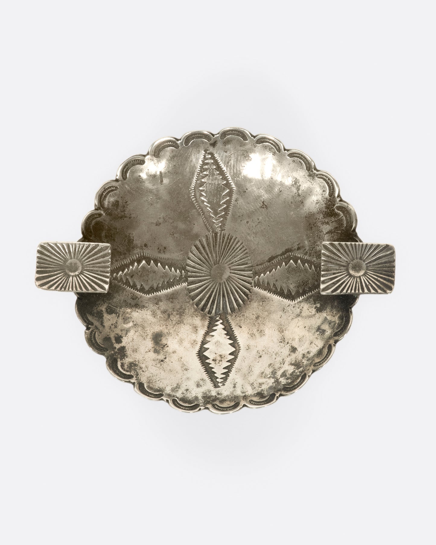 The great patina and stamped details on this vintage Native American ashtray are what bring it to life.