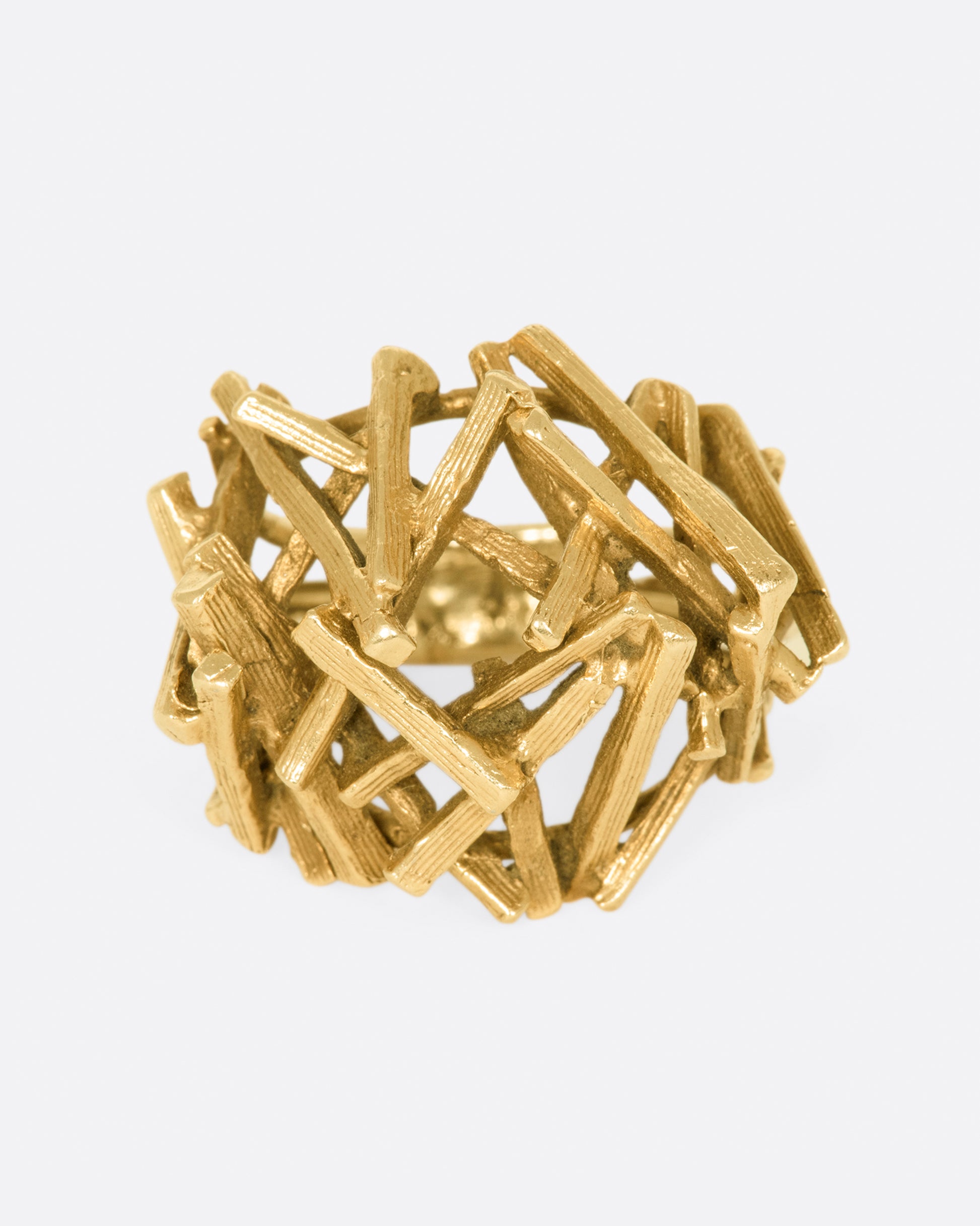 A vintage 15k gold pile of sticks ring that sits high above your finger in an incredible 3D dome