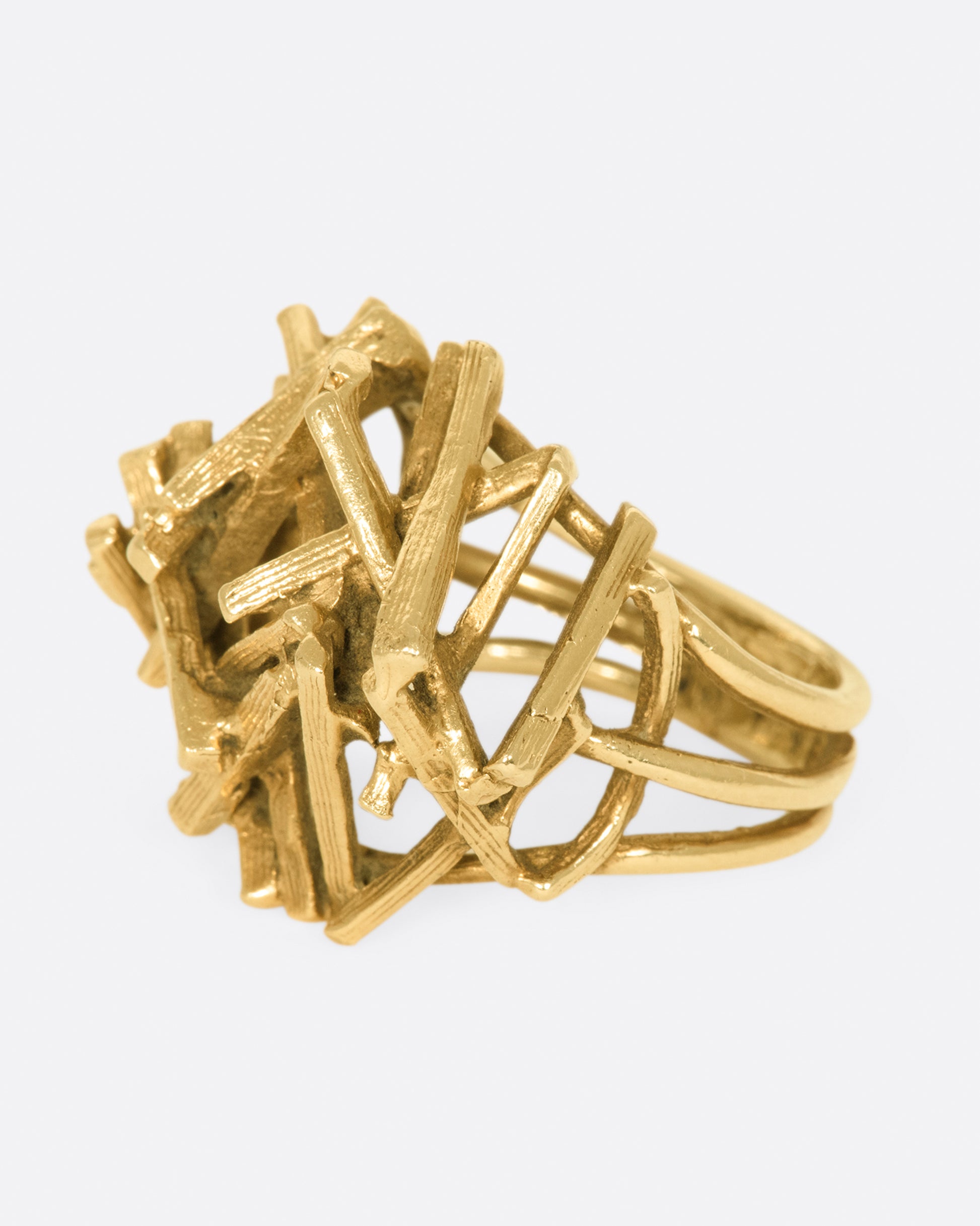 A vintage 15k gold pile of sticks ring that sits high above your finger in an incredible 3D dome