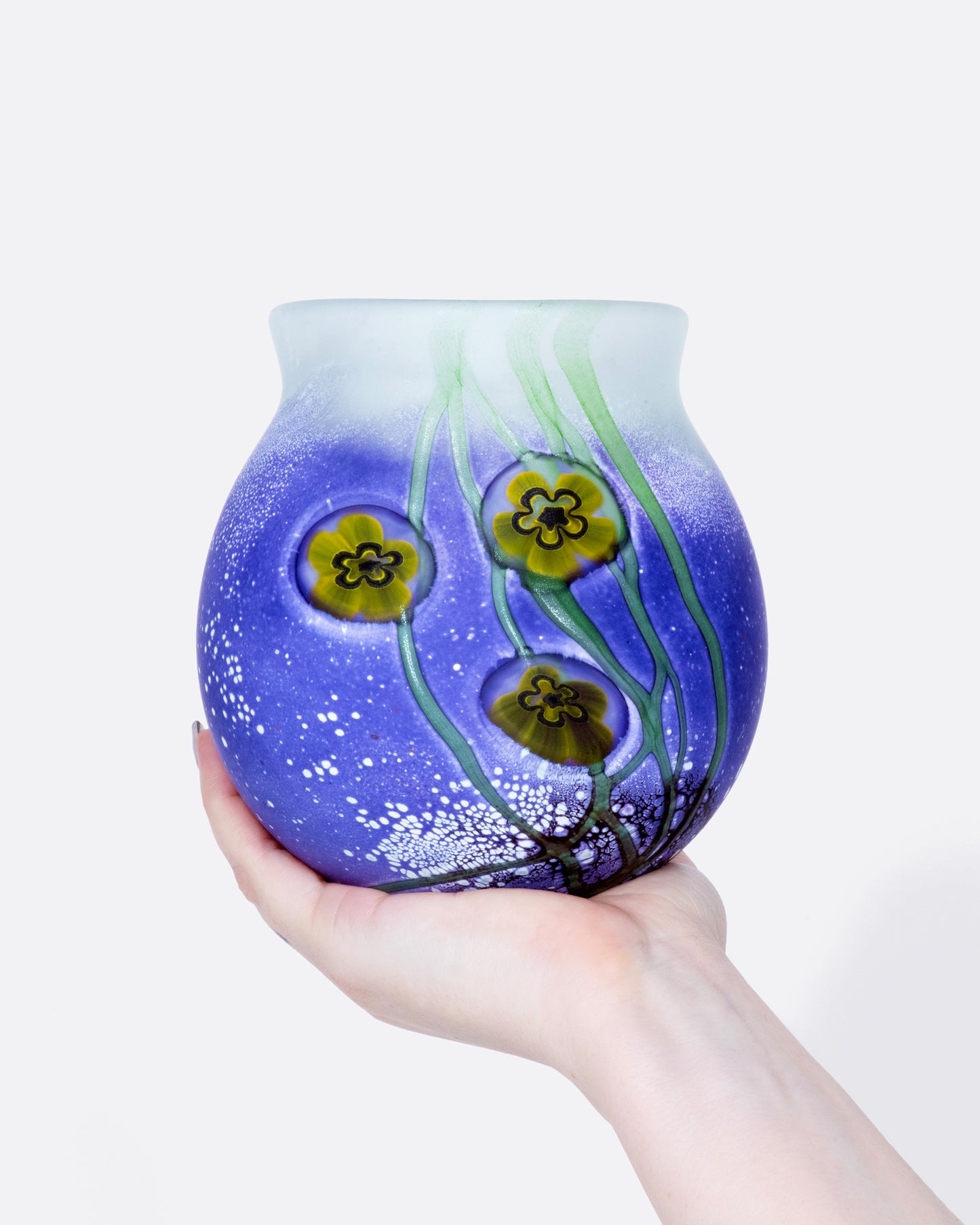 This heavy, frosted glass vase is mesmerizing from every angle.