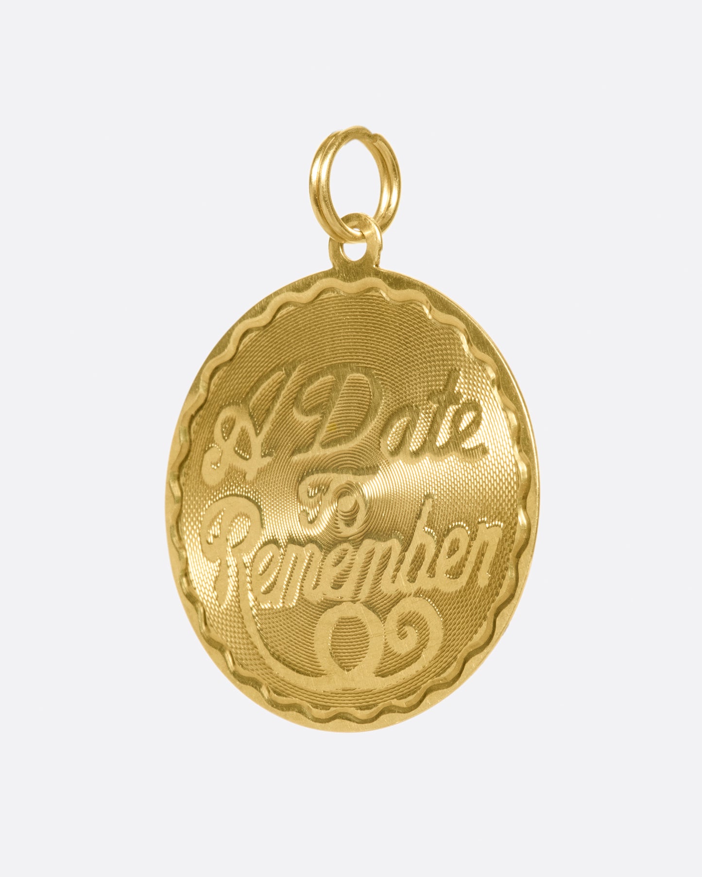 This medallion charm is blank on the back, waiting to be engraved with a date that's important to you.