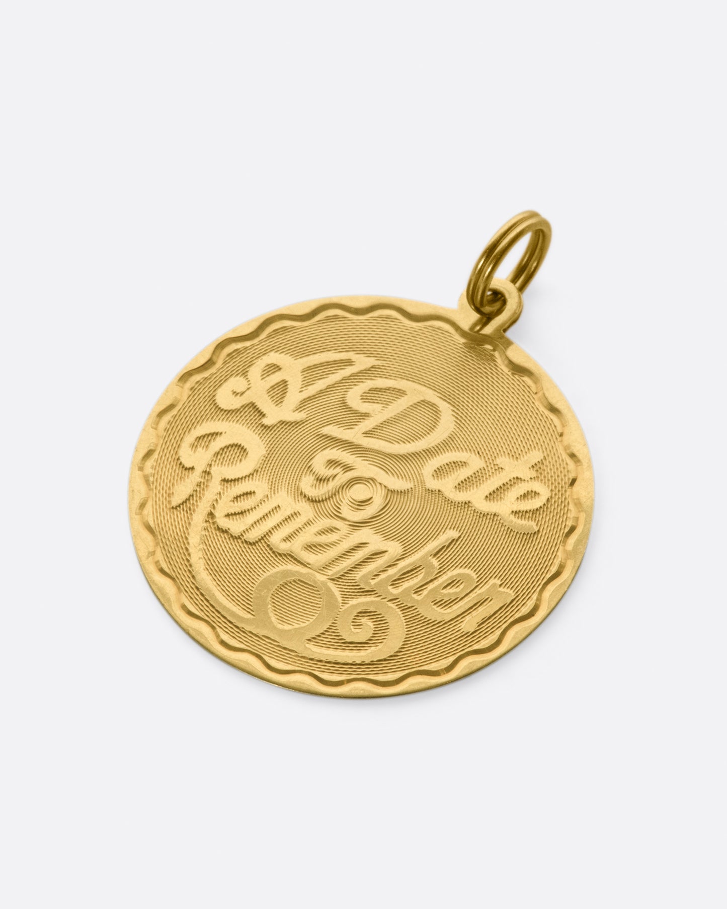 This medallion charm is blank on the back, waiting to be engraved with a date that's important to you.