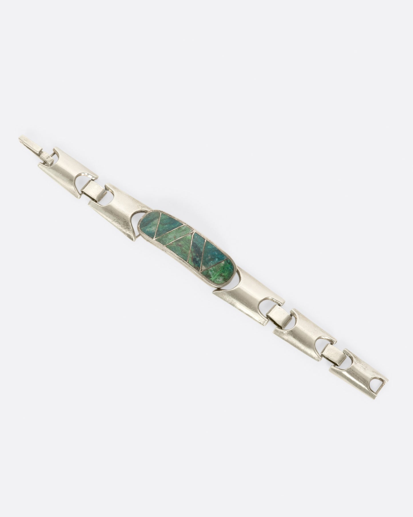 This handmade bracelet is one of two that we were lucky enough to find! Its mate is the same style, but with bright green malachite.