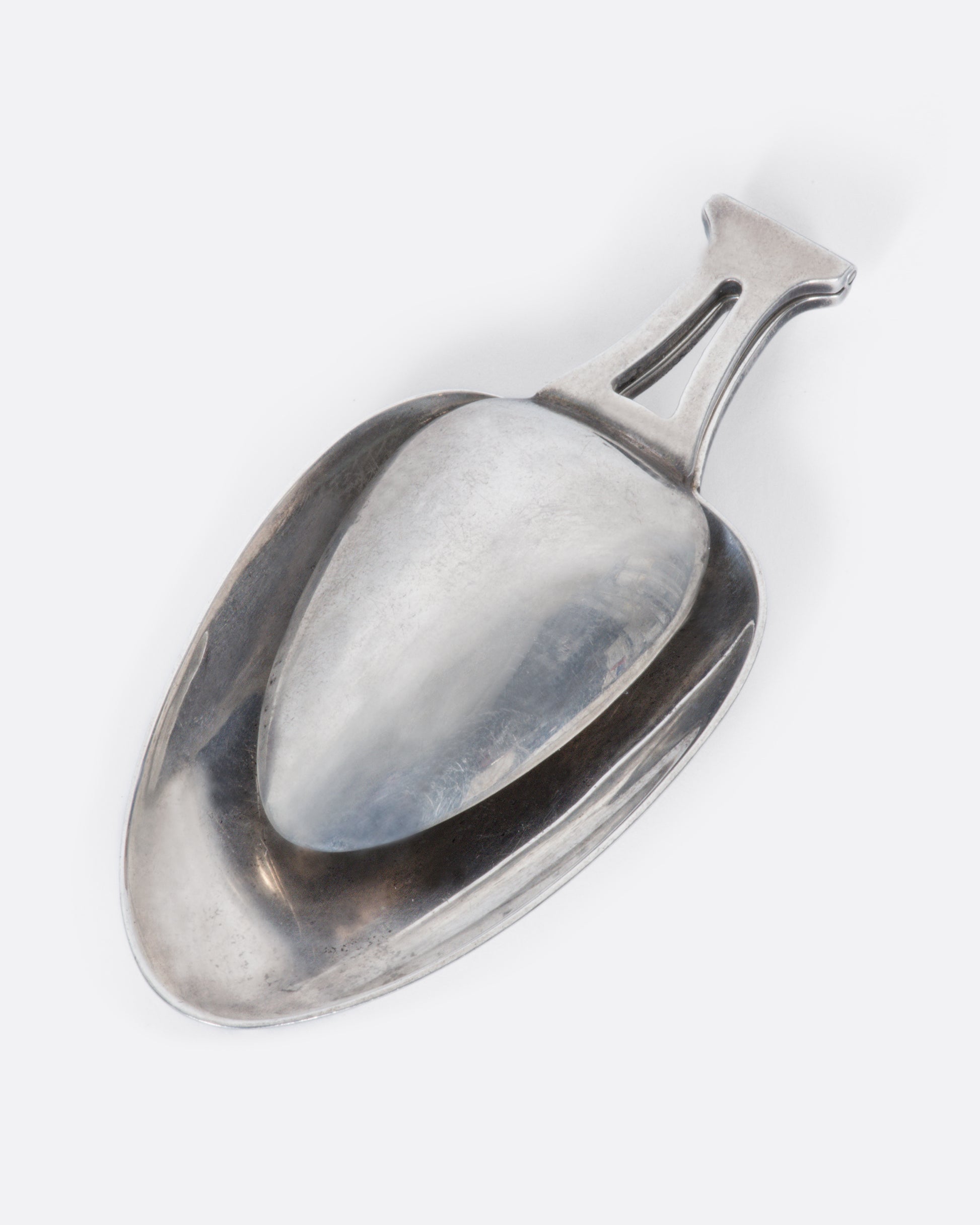 A sterling silver folding spoon with a teaspoon on one side and a tablespoon on the other.