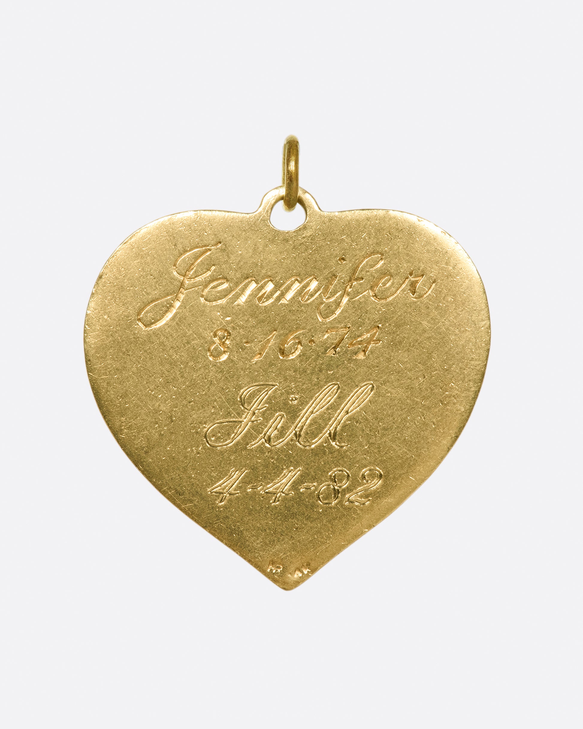 A large, textured heart tag with sweet sentiments on either side.