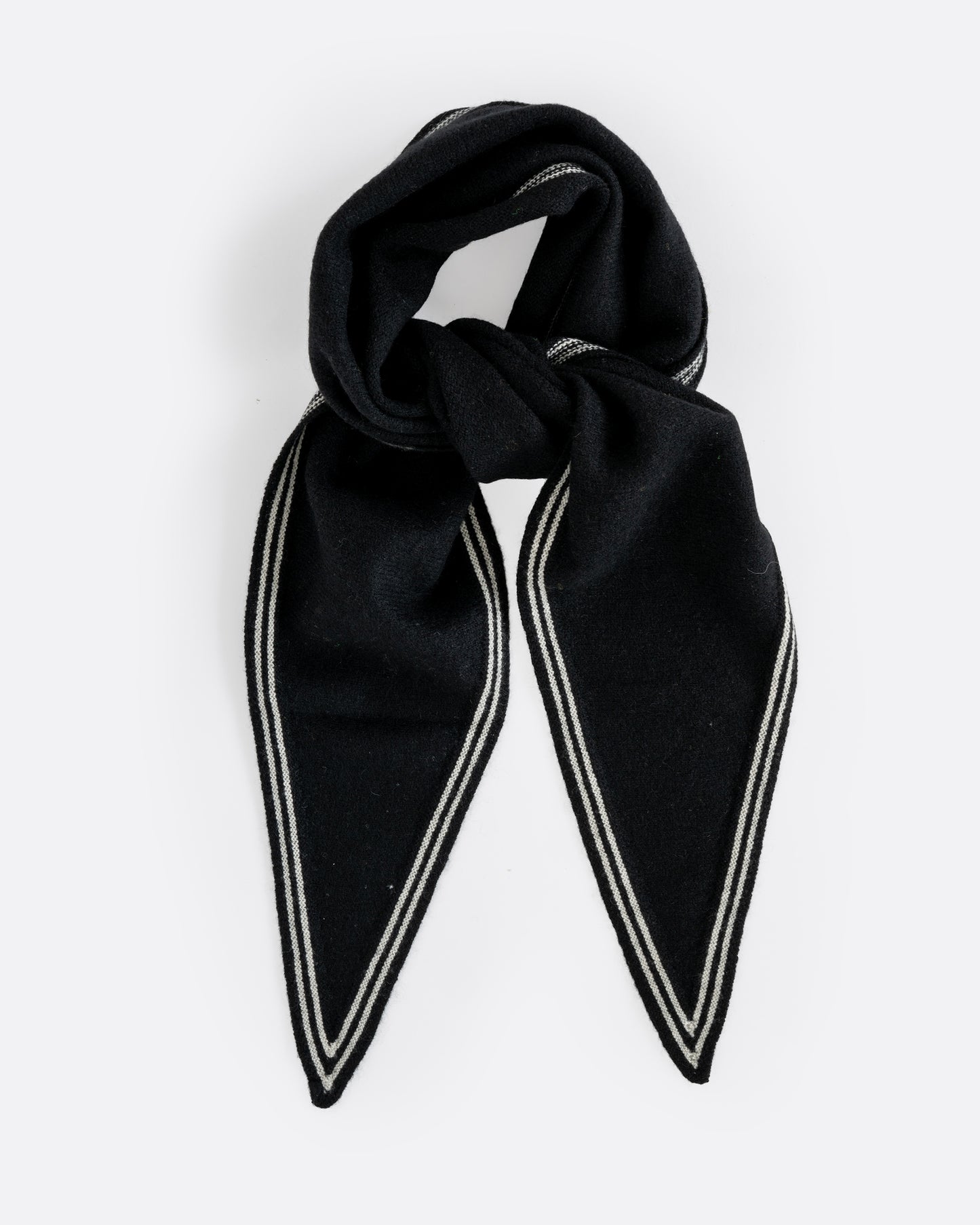 A cashmere black neck scarf with stripy white edges, shown tied from the front.