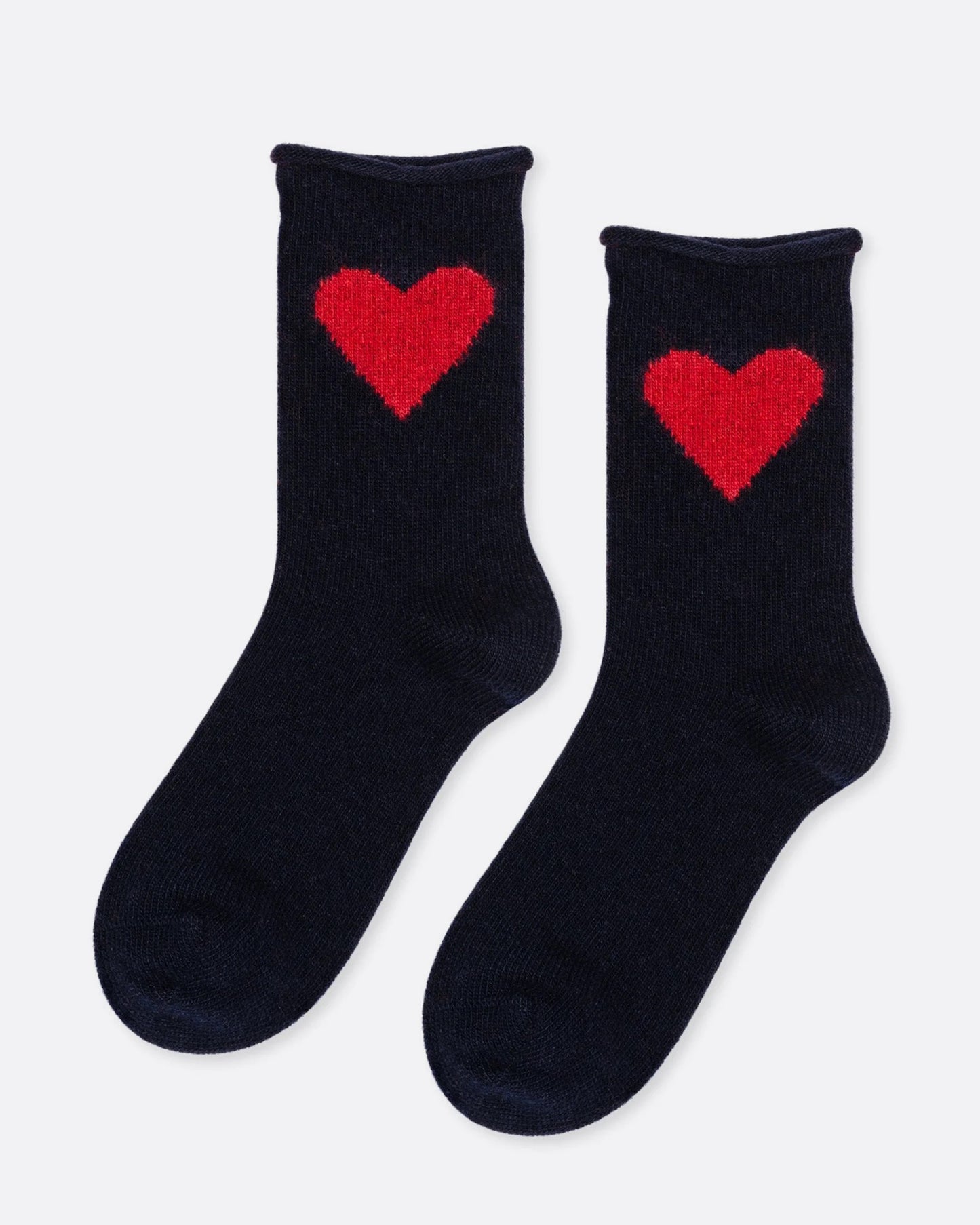 A pair of black socks with a single red heart on the ankle. Shown from the side.