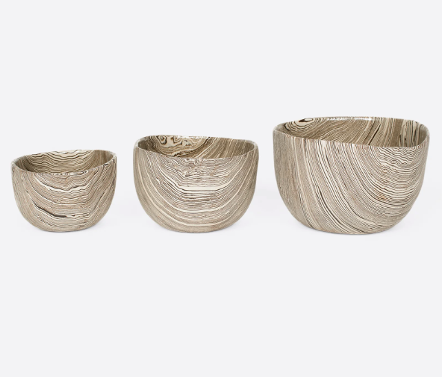 A group of three white and brown stoneware nerikomi bowls. Shown from smallest to biggest from the front.