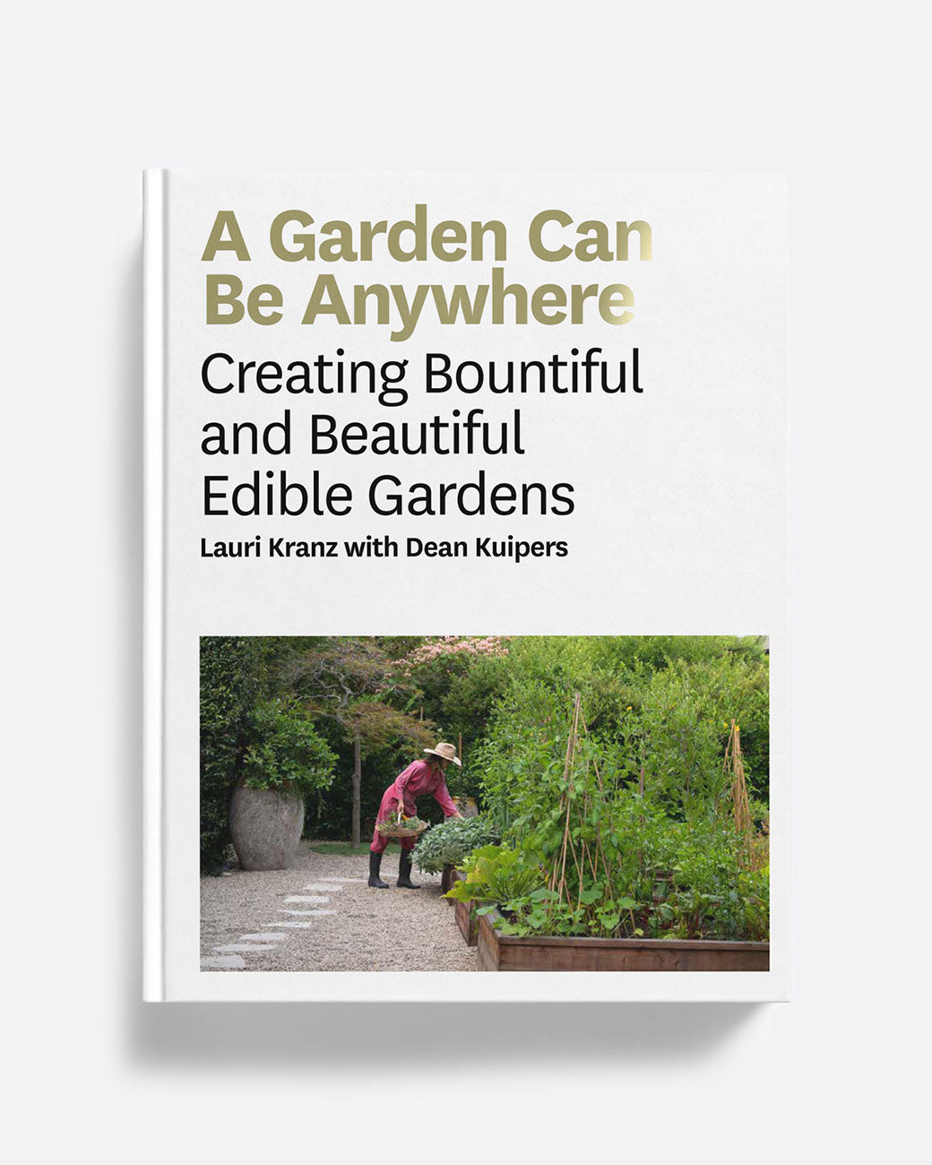 A white book cover with a photo of a garden and 'A Garden Can By Anywhere by Lauri Kranz and Dean Kuipers'. Shown lying flat.