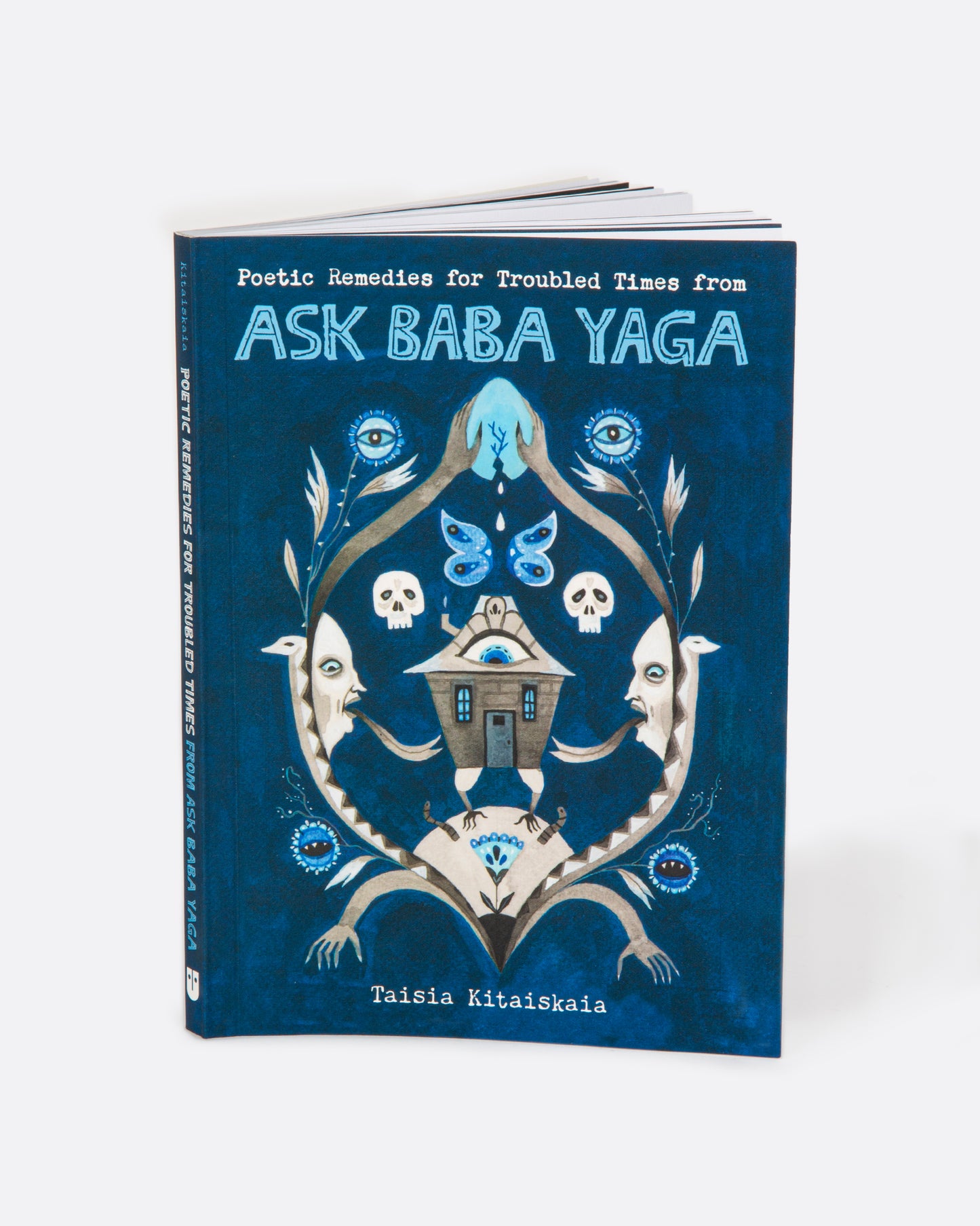 The book 'Ask Baba Yaga' by Taisia Kitaiskaia with a blue cover and Baby Yaga imagery. Shown standing up from the front.