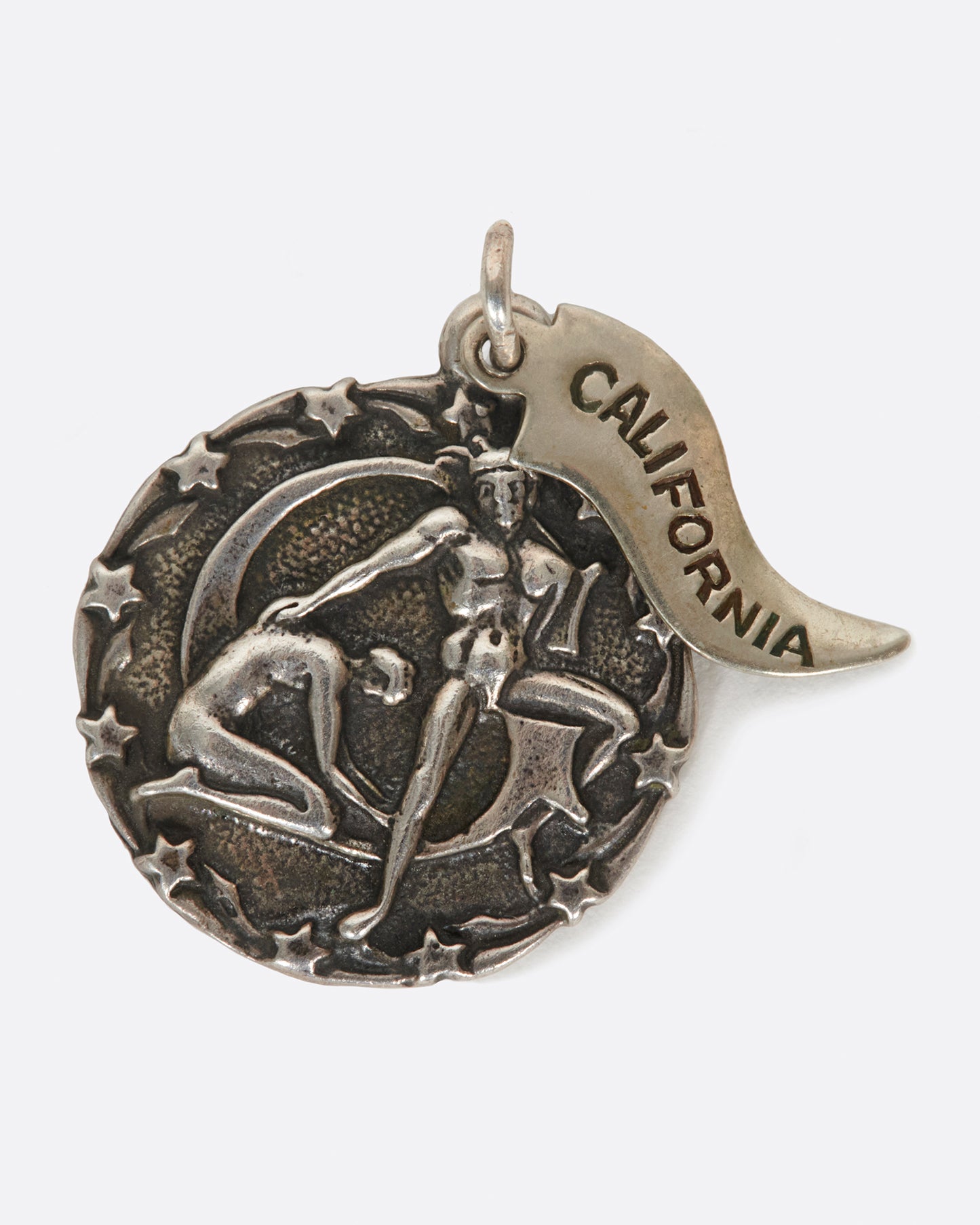 A round medal pendant with your zodiac sign and a California pennant.