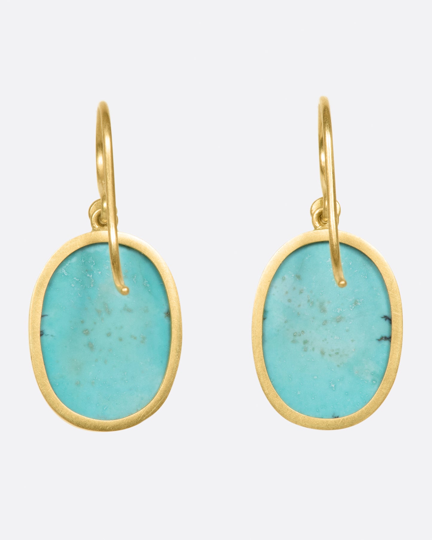 A pair of oval Tibetan turquoise drops set in Lola Brooks' signature bezel settings.