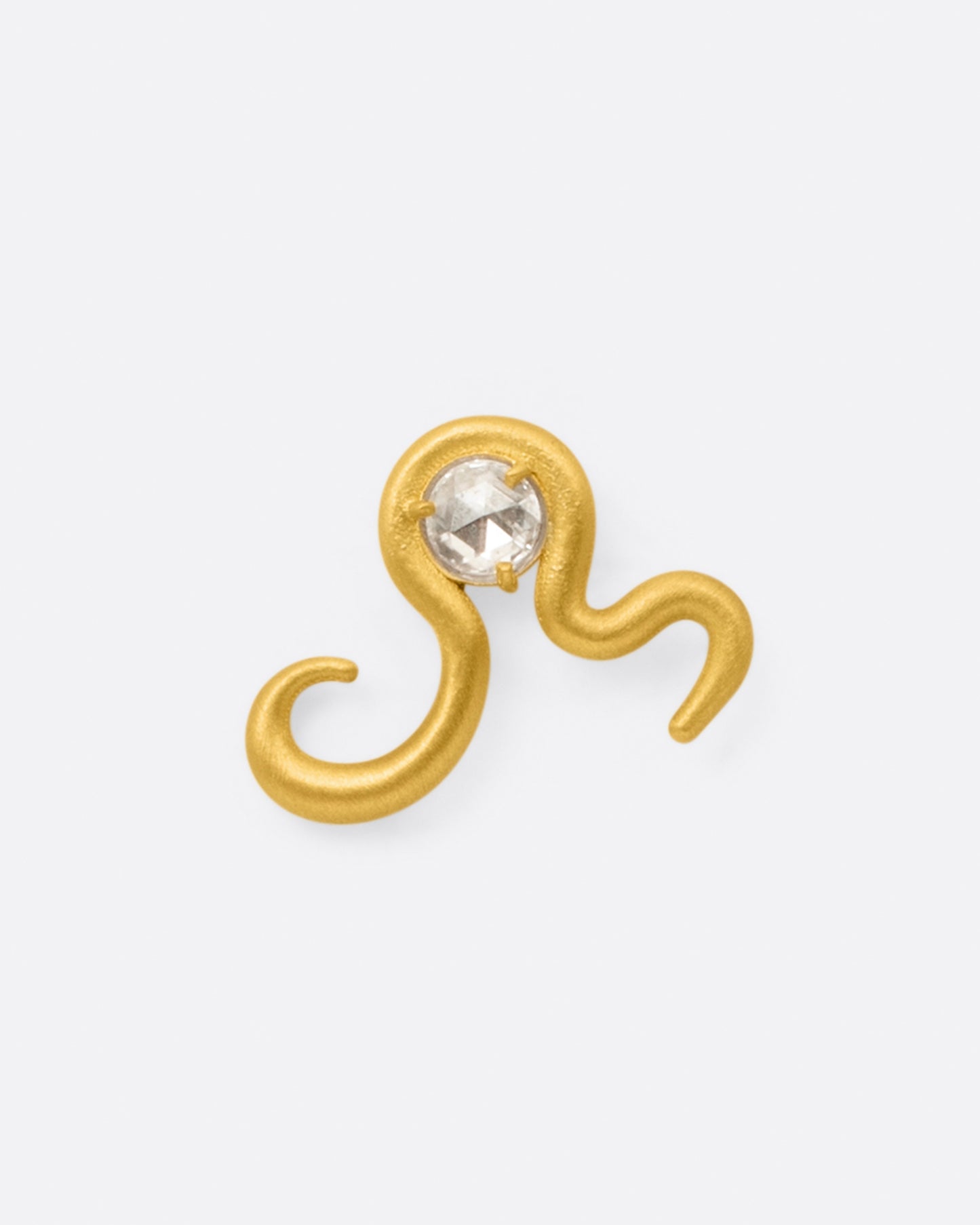 A high karat yellow gold curved snake stud earring with a rose cut diamond at its center, shown from the front.