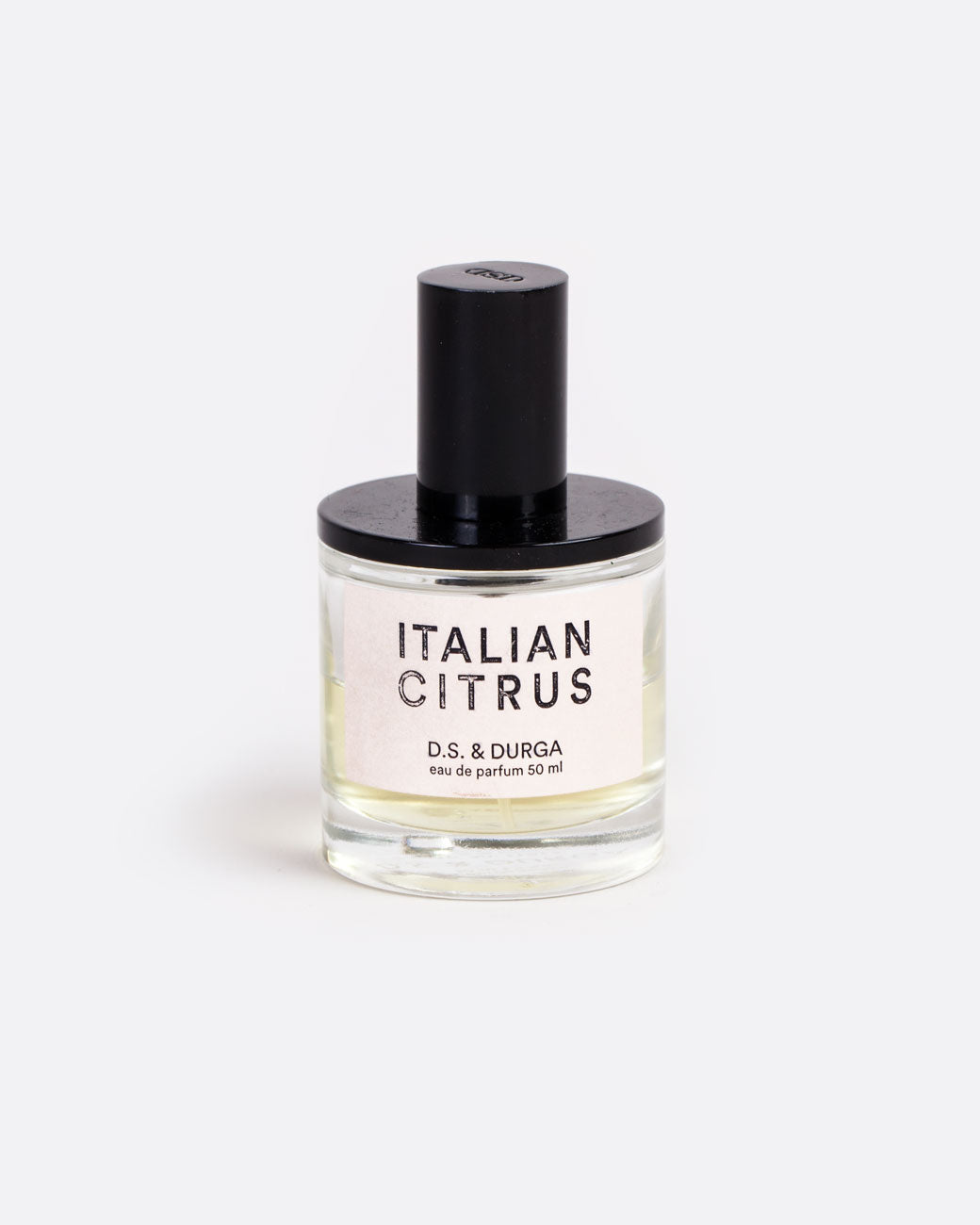 A glass bottle with a label that reads: Italian Citrus D.S. & Durga eau de parfum 50 ml with black shiny spritzer top. Shown from the front.