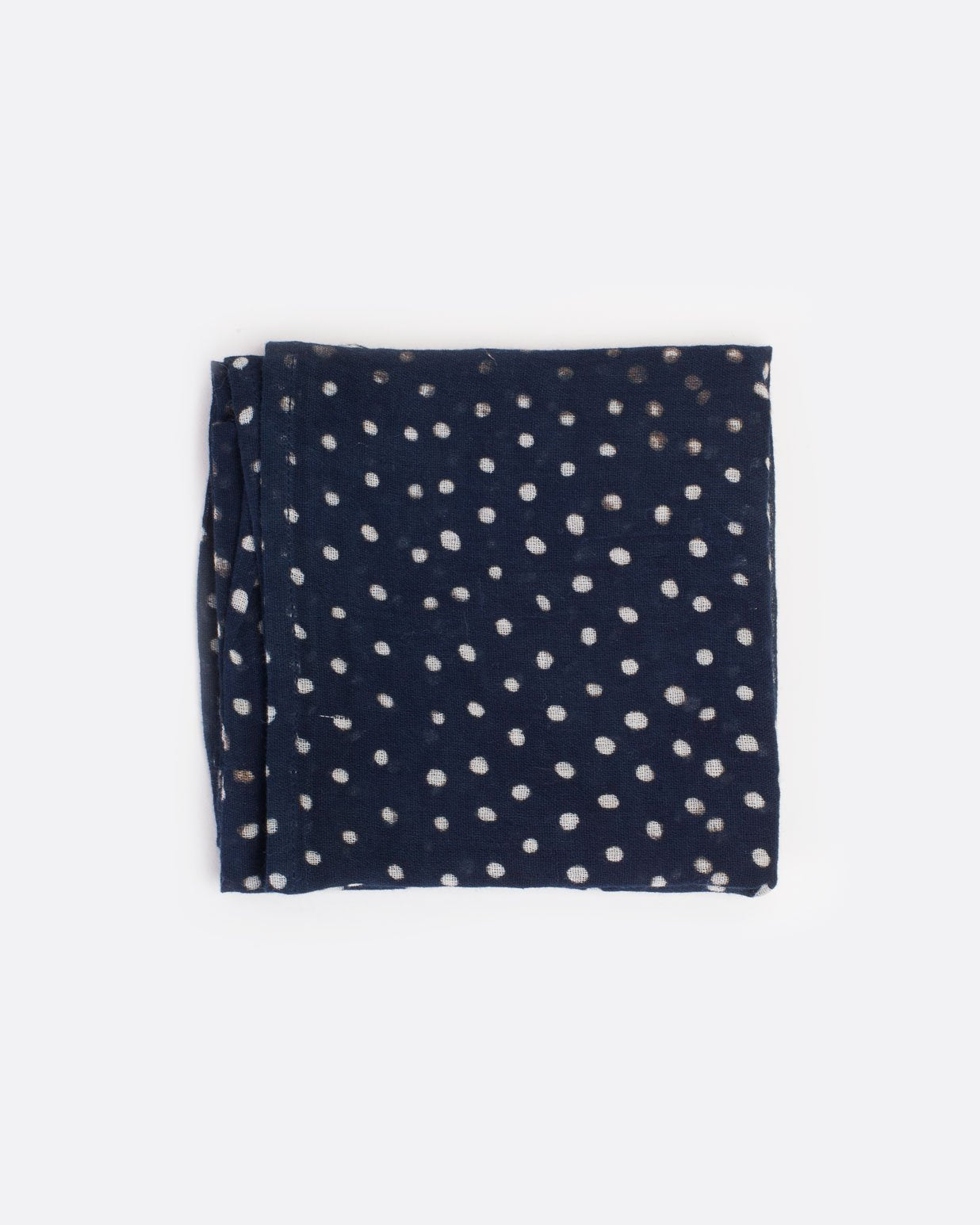 Dark blue bandana with white polka dots, shown folded.