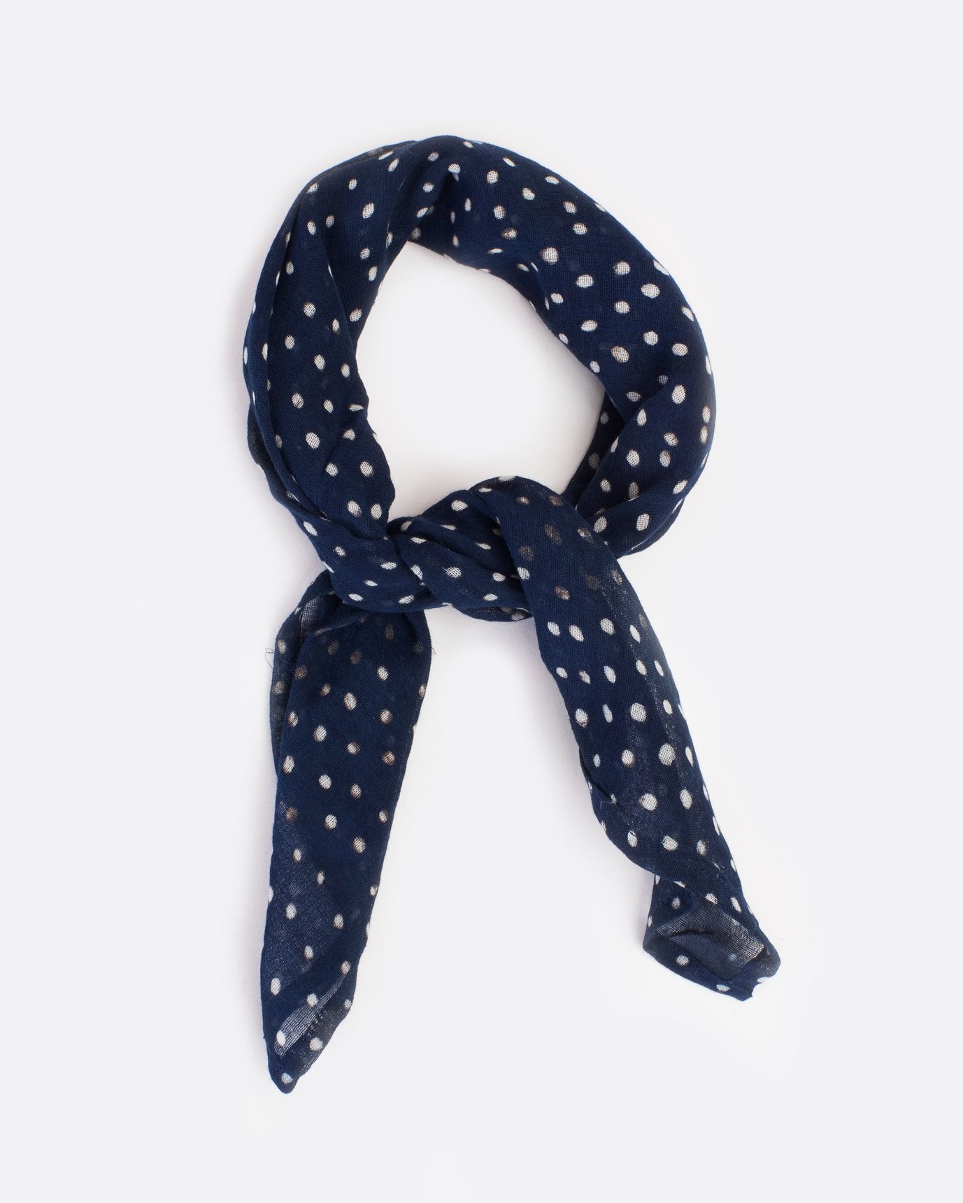 Dark blue bandana with white polka dots, shown tied.