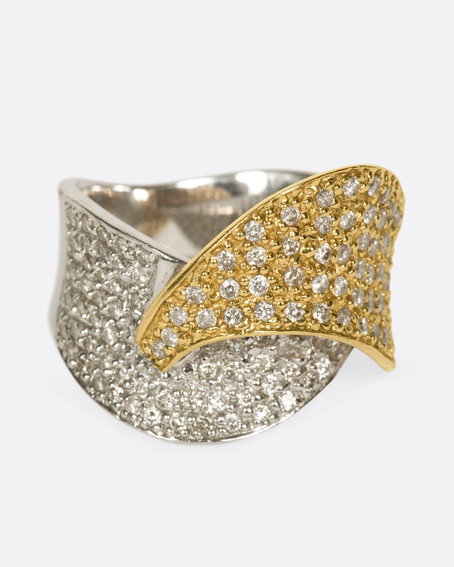 A half white gold, half yellow gold diamond-covered wrap shown from the front.