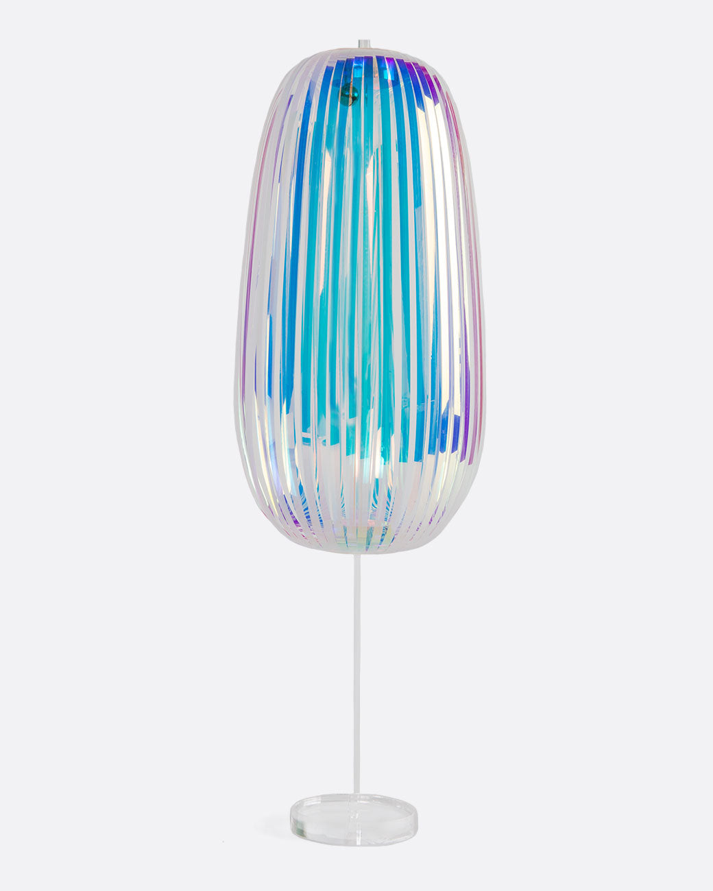 A plastic rainbow stick with an iridescent sheen. Shown from the front in a stand.