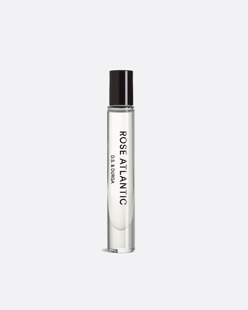 A glass roll on perfume bottle with a black top with 'ROSE ATLANTIC D.S & Durga' in black lettering. Shown standing up from the side.