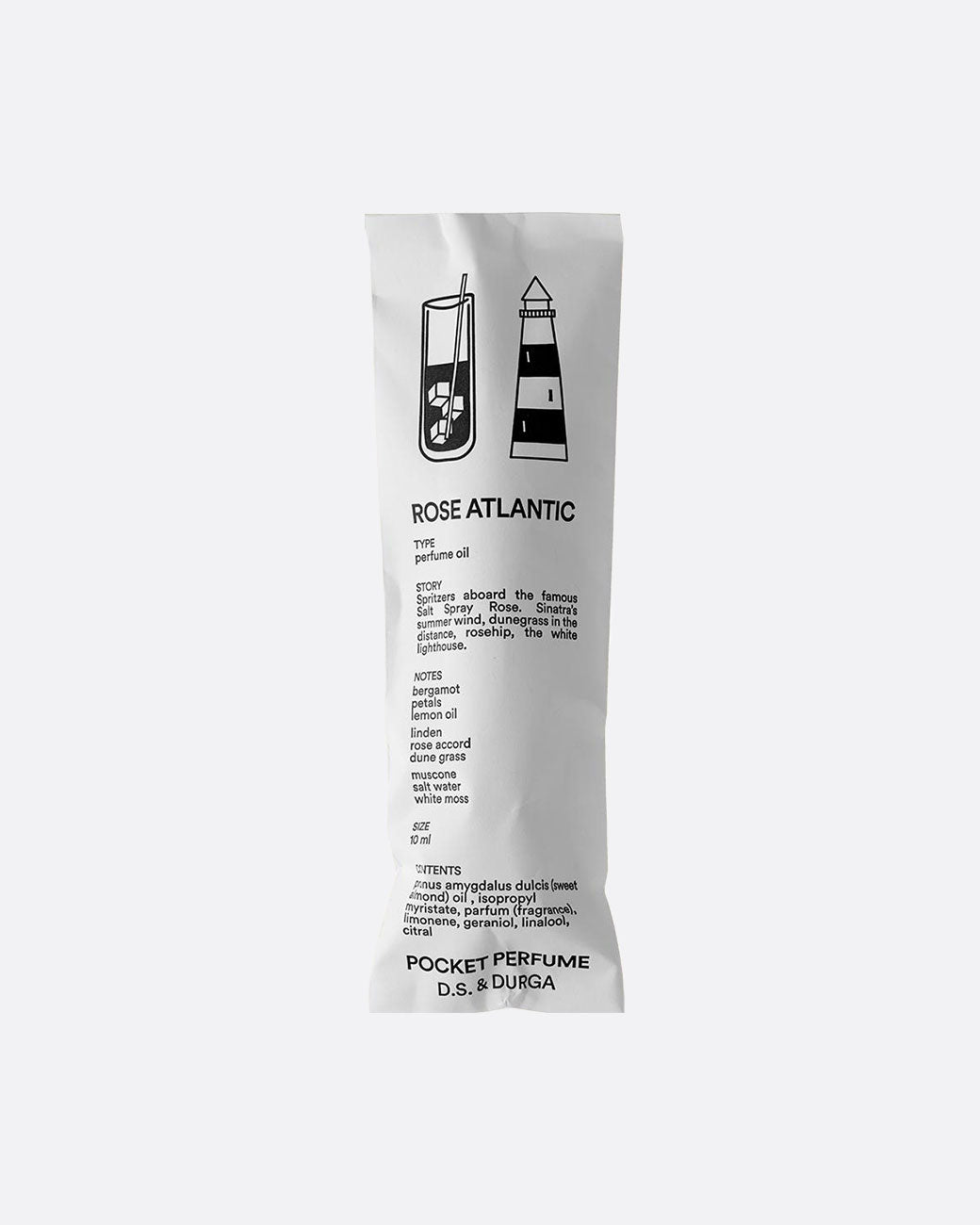 White paper packaging for a glass roll on perfume bottle. The front of the package has 'ROSE ATLANTIC POCKET PERFUME D.S & Durga' in black lettering with product information. An image of a glass of iced tea and a light house appear at the top. Shown from the front.