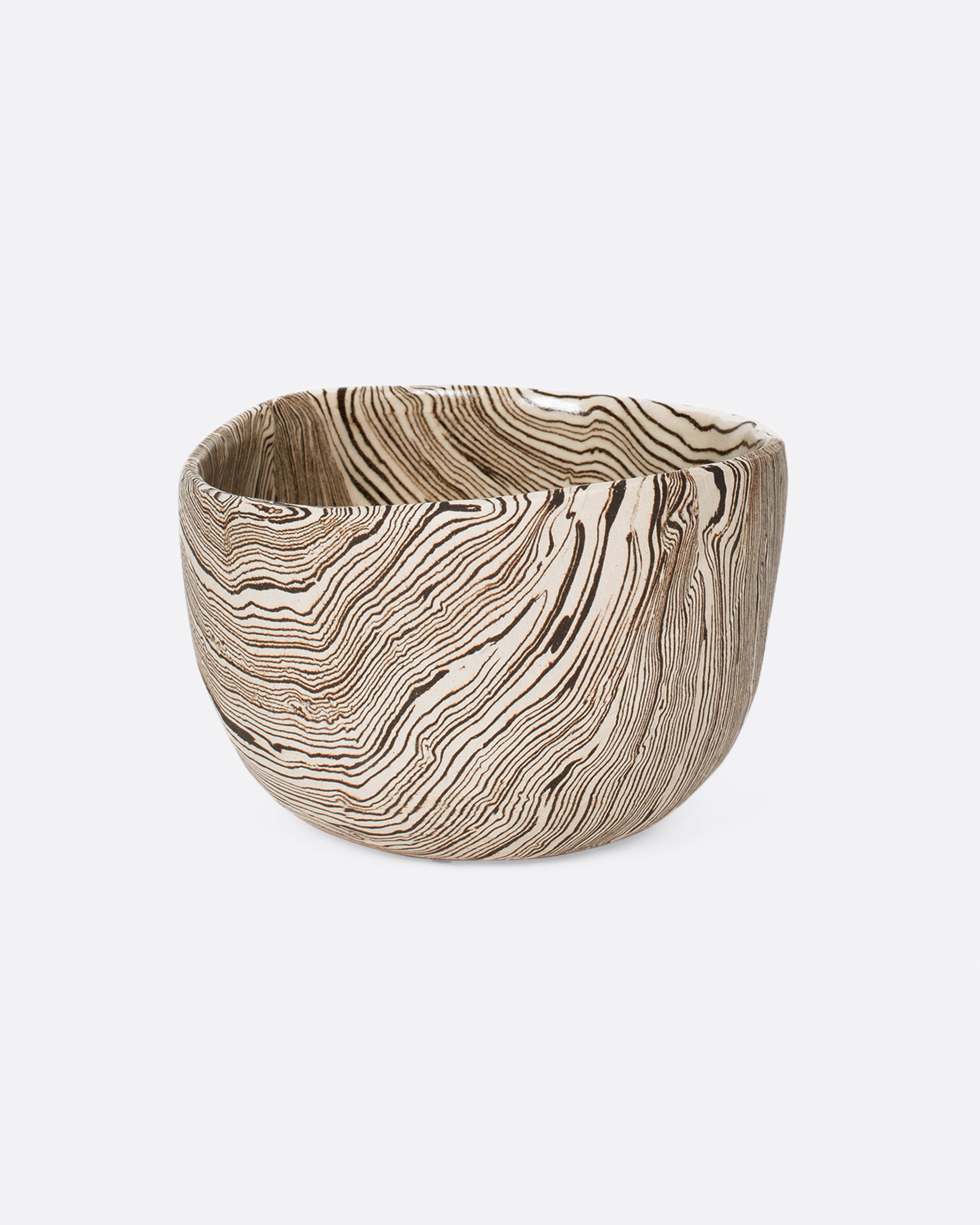 Small brown and white stoneware nerikomi bowl. Shown from the front.