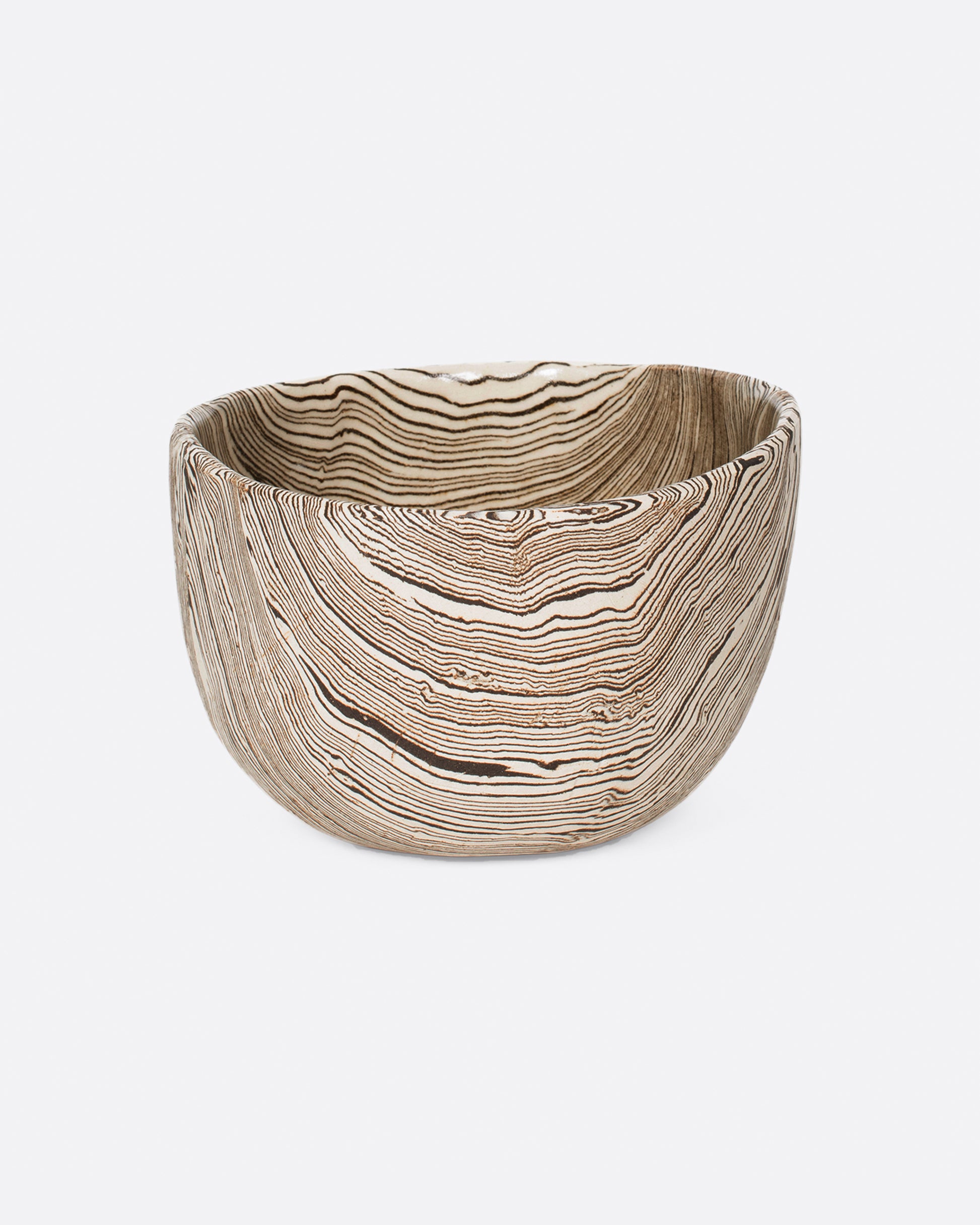 Small brown and white stoneware nerikomi bowl. Shown from the front.