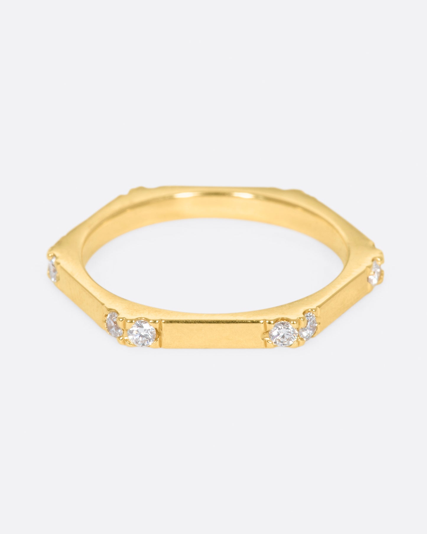 A hefty, hexagonal ring with diamond on each corner.